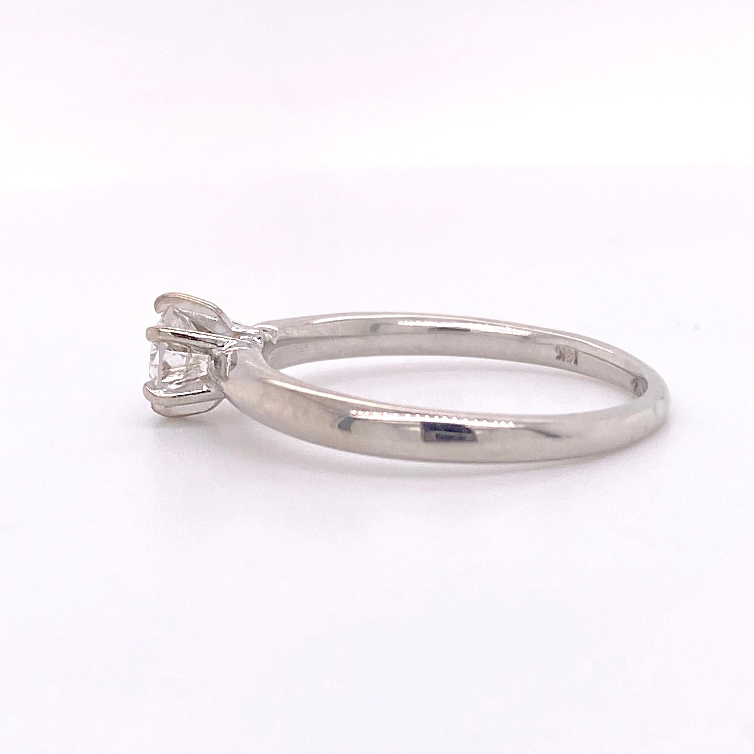 This is a 14 karat white gold solitaire ring with a .65 carat round brilliant cut diamond. The solitaire is the perfect engagement ring for any woman! The six prongs hold the diamond very securely and look great paired with a diamond wedding band or