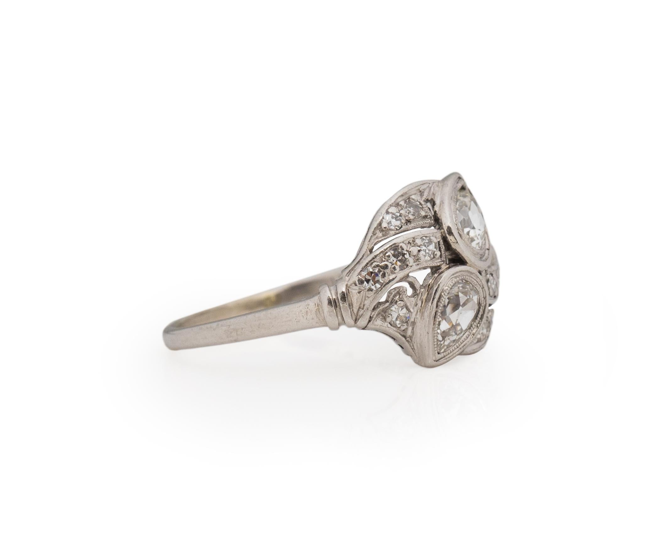 Ring Size: 7.75
Metal Type: Platinum [Hallmarked, and Tested]
Weight: 4.0 grams

Diamond Details:
Weight: .65ct, total weight
Cut: Old European brilliant, Antique Pears
Color: H/I
Clarity: VS

Finger to Top of Stone Measurement:4.5 mm
Condition: