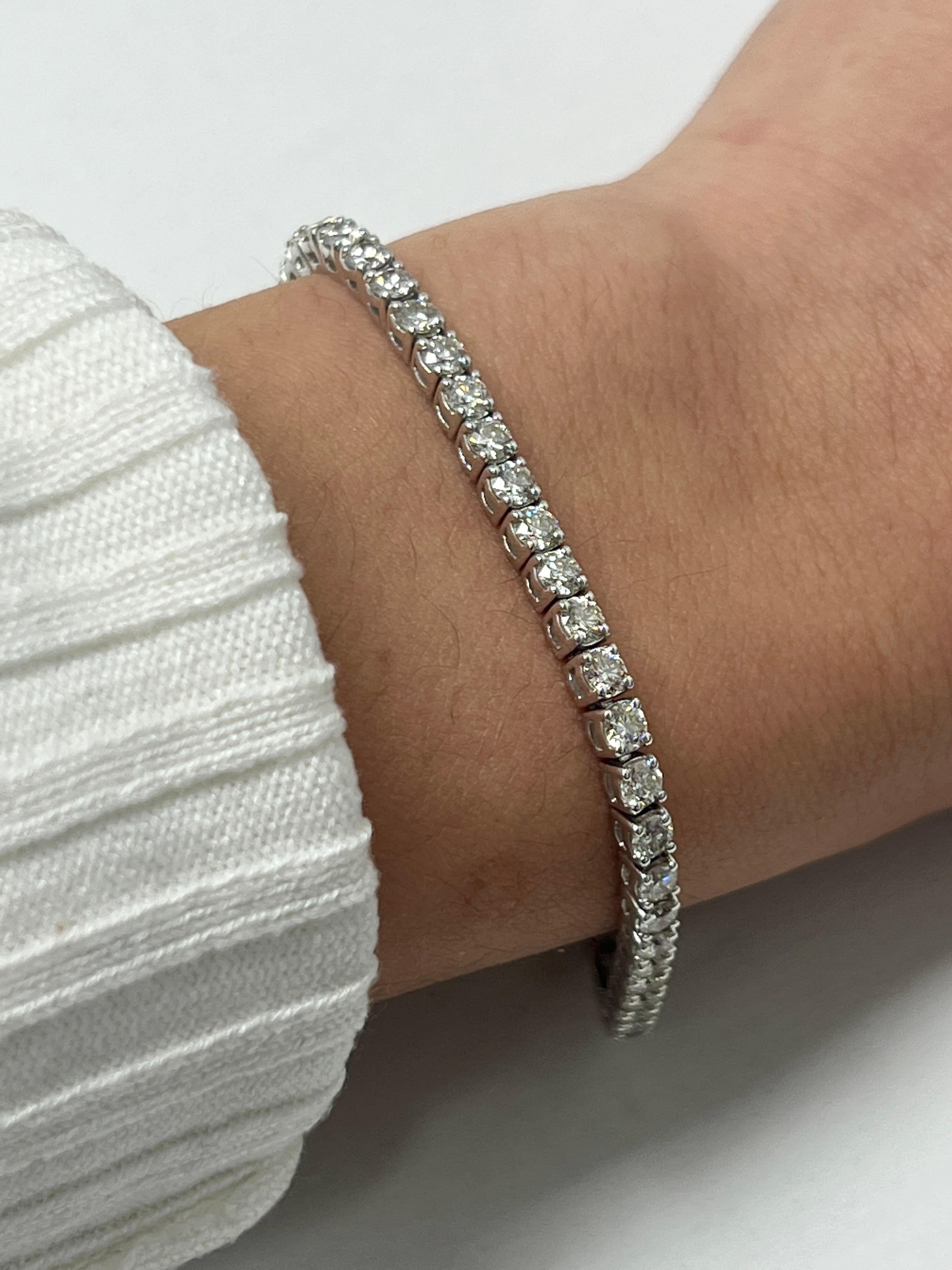 Fashion and glam are at the forefront with this exquisite diamond bracelet. This 18-karat white gold diamond bracelet is made from 13.3 grams of gold. The top is adorned with one row of I-J color, VS/SI clarity diamonds. This bracelet carries 48