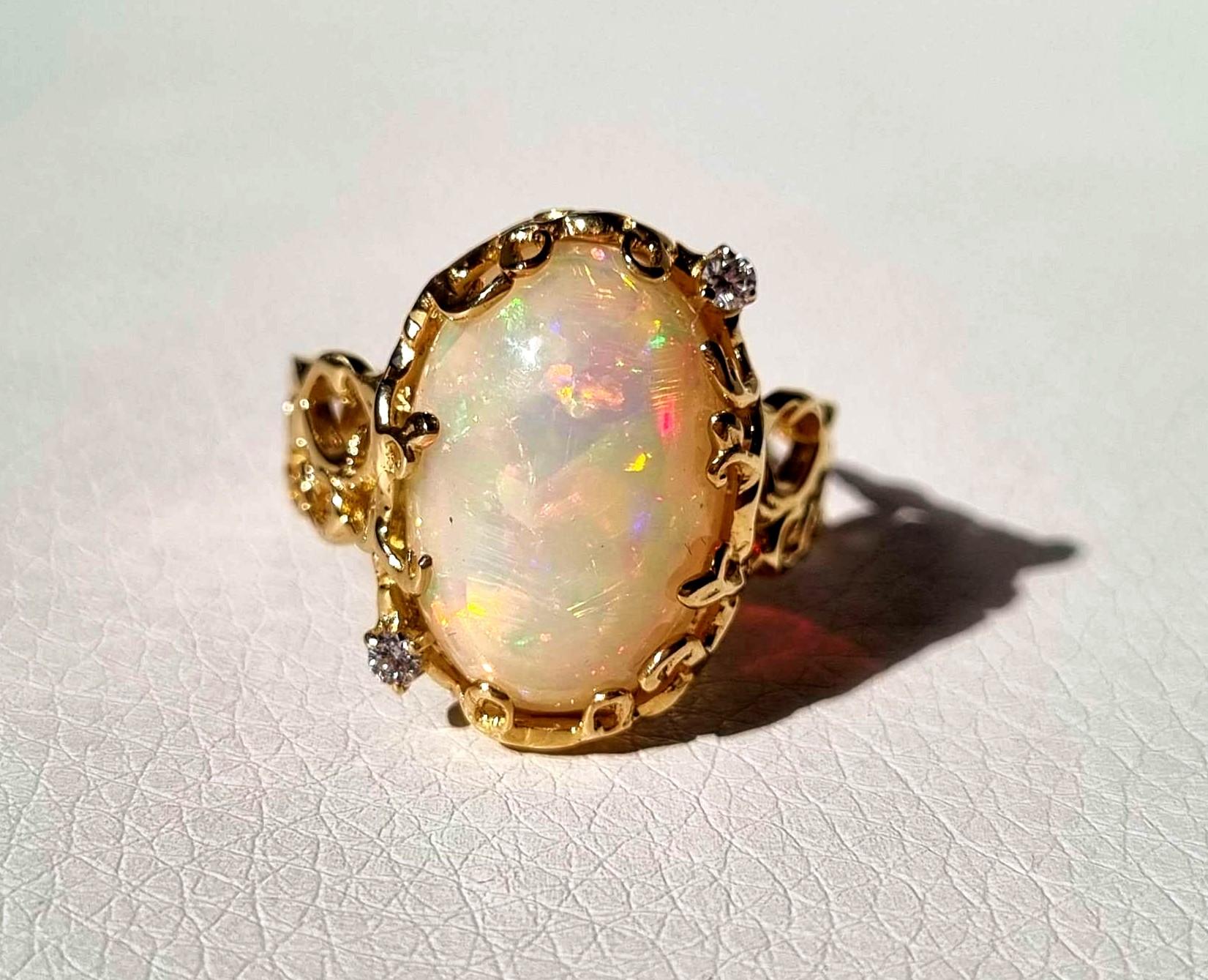 Material: 14k solid white gold
Ring custom made-to-order. Please take under consideration up to 3 weeks time of production, please

Main Stone Type: Ethiopian Opal, oval cut
Weight: 6.5 ct
Color: translucid, opalescent
Treatment: N/A

Secondary