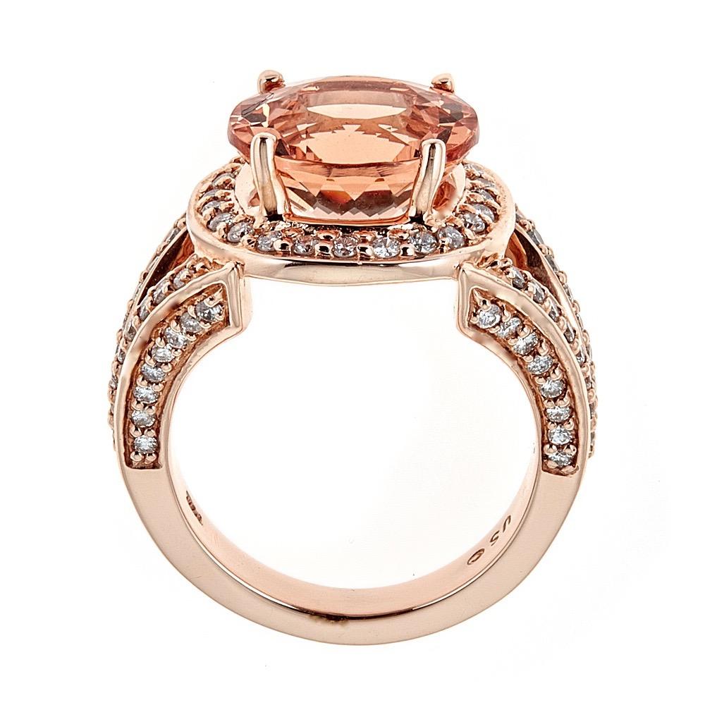 Handcrafted in 14K rose gold, this ring features a 6.5 carat morganite with round brilliant diamonds.