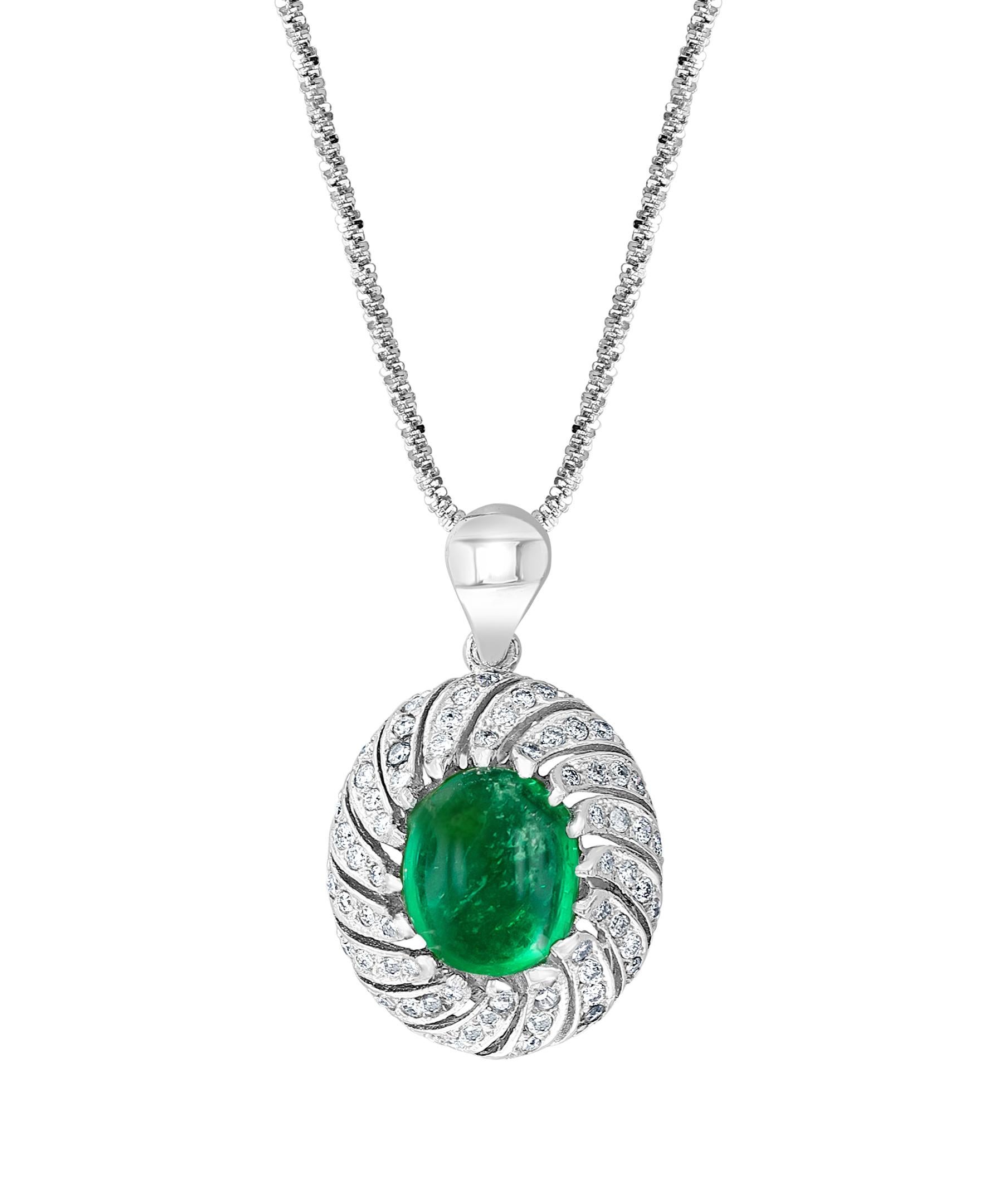 Approximately 6.5 Ct Natural Emerald Zambia Cabochon & Diamond Pendant in 14 K white gold

 Emerald is about 6.5 carat 
Very desirable color and quality. Extreme fine color and clarity.
No chain
Emerald origin is Zambia
Brilliant cut diamonds are