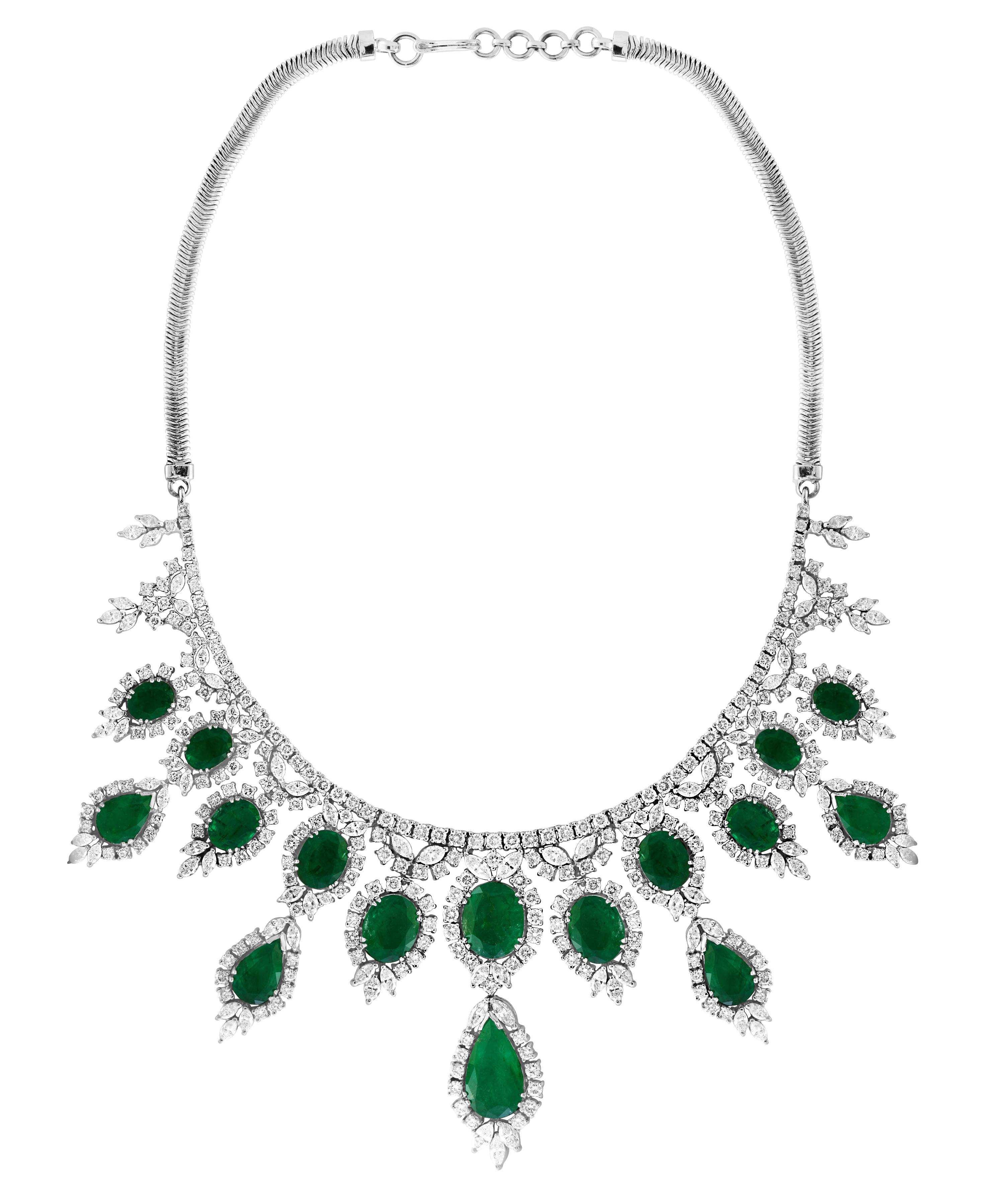 Pear Shape  Emerald And Diamond  Necklace And Earring  Bridal Suite Estate
This spectacular Bridal set  consisting of one large approximately  6.5 Carat Pear shape  Emerald  in the center  surrounded by brilliant cut diamonds .
A magnificent emerald