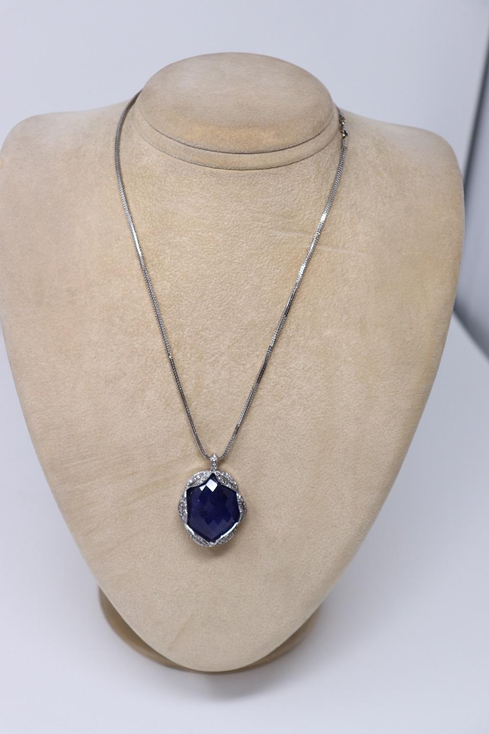 Oval Cut 65 Ct Tanzanite and Diamond Pendant Necklace in 18 Kt White Gold For Sale