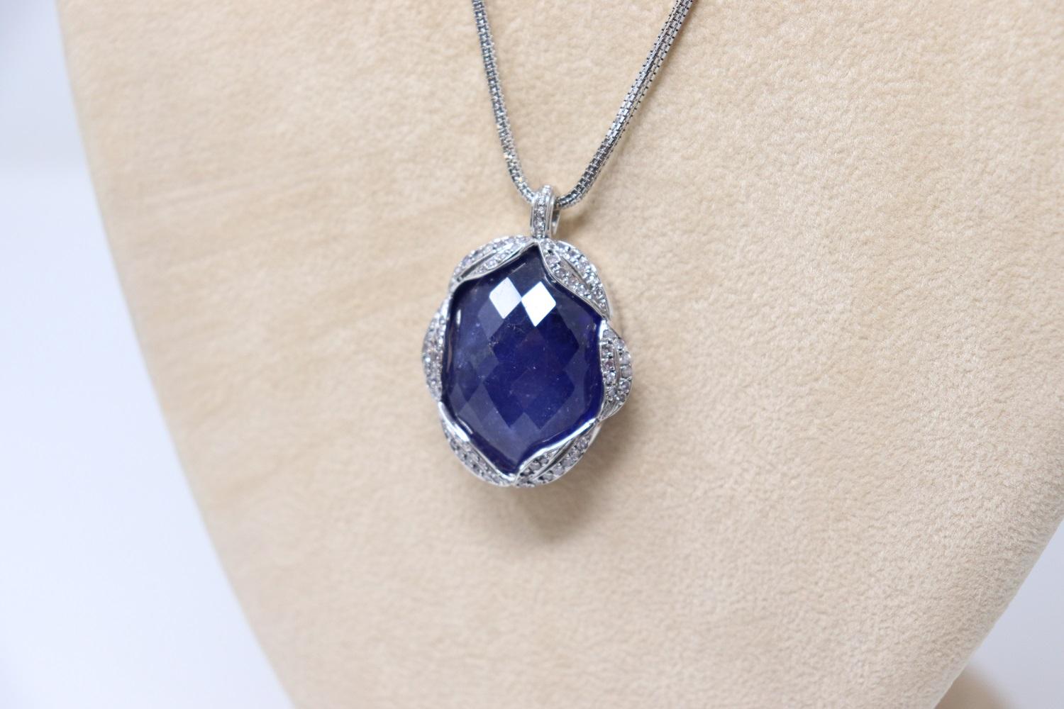 Women's 65 Ct Tanzanite and Diamond Pendant Necklace in 18 Kt White Gold For Sale