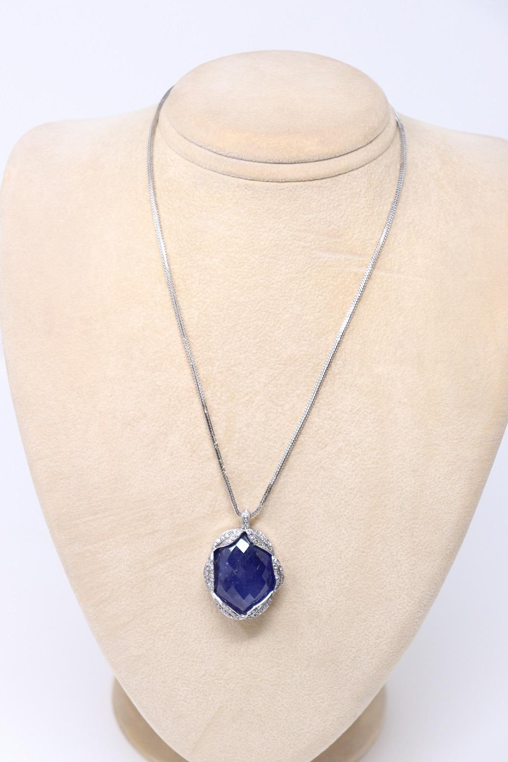 65 Ct Tanzanite and Diamond Pendant Necklace in 18 Kt White Gold For Sale 2
