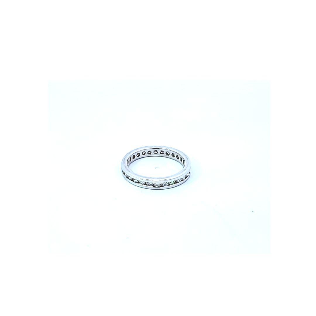 This lovely eternity ring is in 14 karat white gold and supports 0.65 carats of round diamonds!