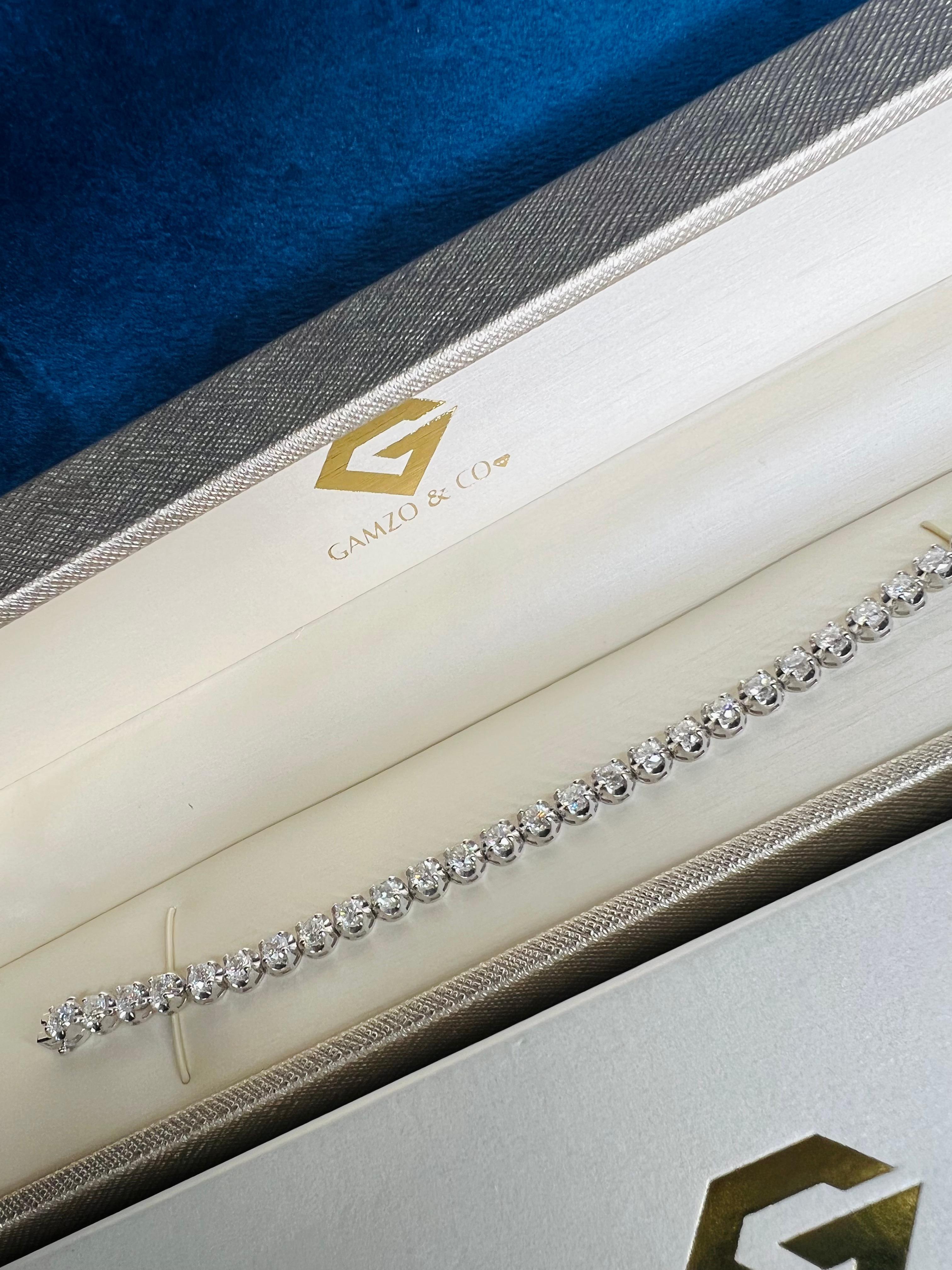 These beautiful round diamonds dance around your wrist as they absorb light and attention.
Metal: 14k Gold
Diamond Cut: Round
Diamond Total Carats: 6.5ct
Diamond Clarity: VS
Diamond Color: F
Color: White Gold
Bracelet Length: 5.5 Inches 
Included