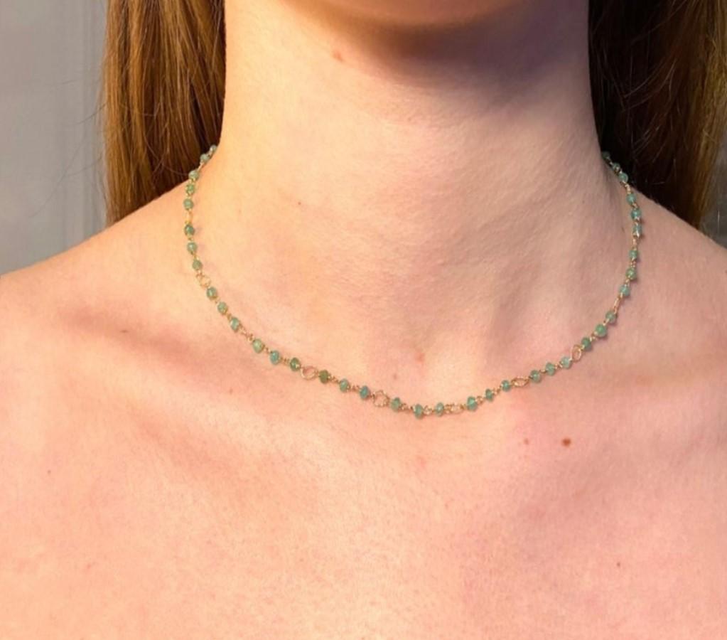 Rossella Ugolini Design collection , a dainty and pretty beaded 6.5 karats necklace made with 18 karats yellow gold and green shade emeralds beads handcrafted one by one. Every 3 emeralds there's an handcrafted twisted link. 
This delicate necklace