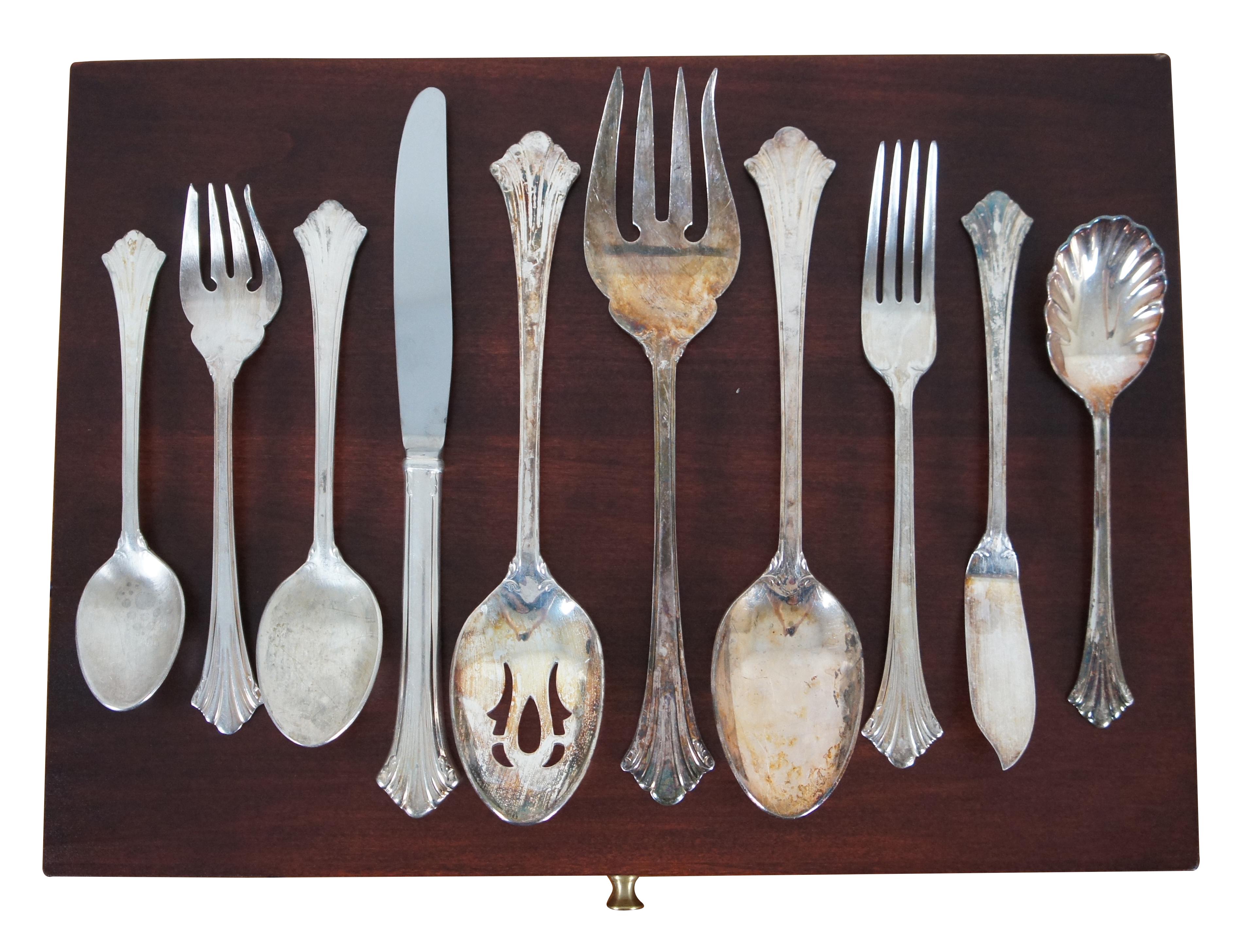 Vintage sixty five piece set of Reed and Barton silver plate flatware in the Highlands pattern (introduced in 1994) including service for 12, several serving utensils, and storage box.

