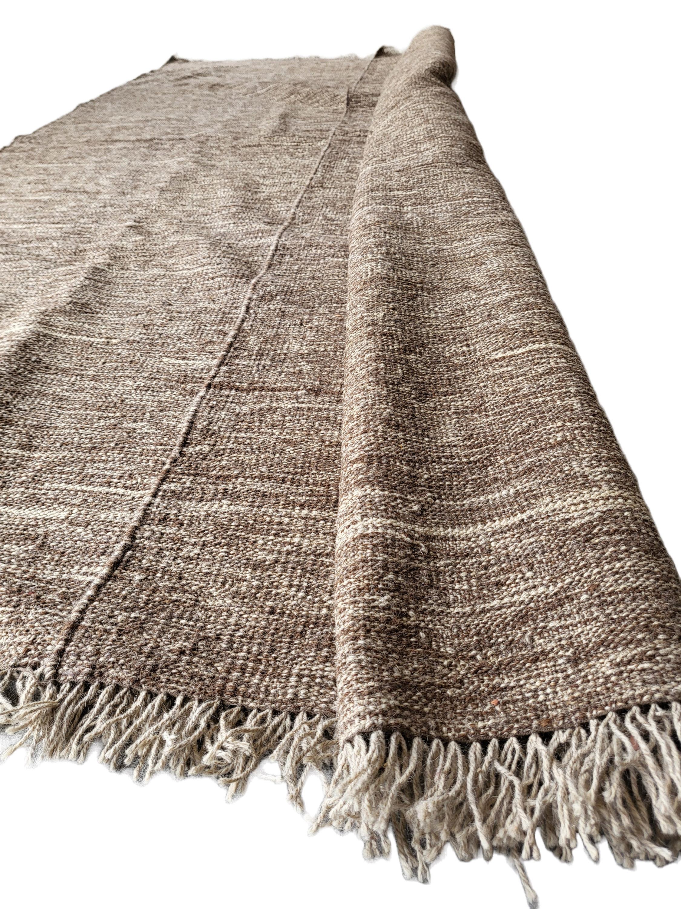 Incredible contemporary designer Gabbeh Kilim. This beautiful, neutral toned piece was commissioned for a special series of Kilims that focus on the beauty of natural wool tones. This kilim is dye free and 100% natural wool. The undyed wool was