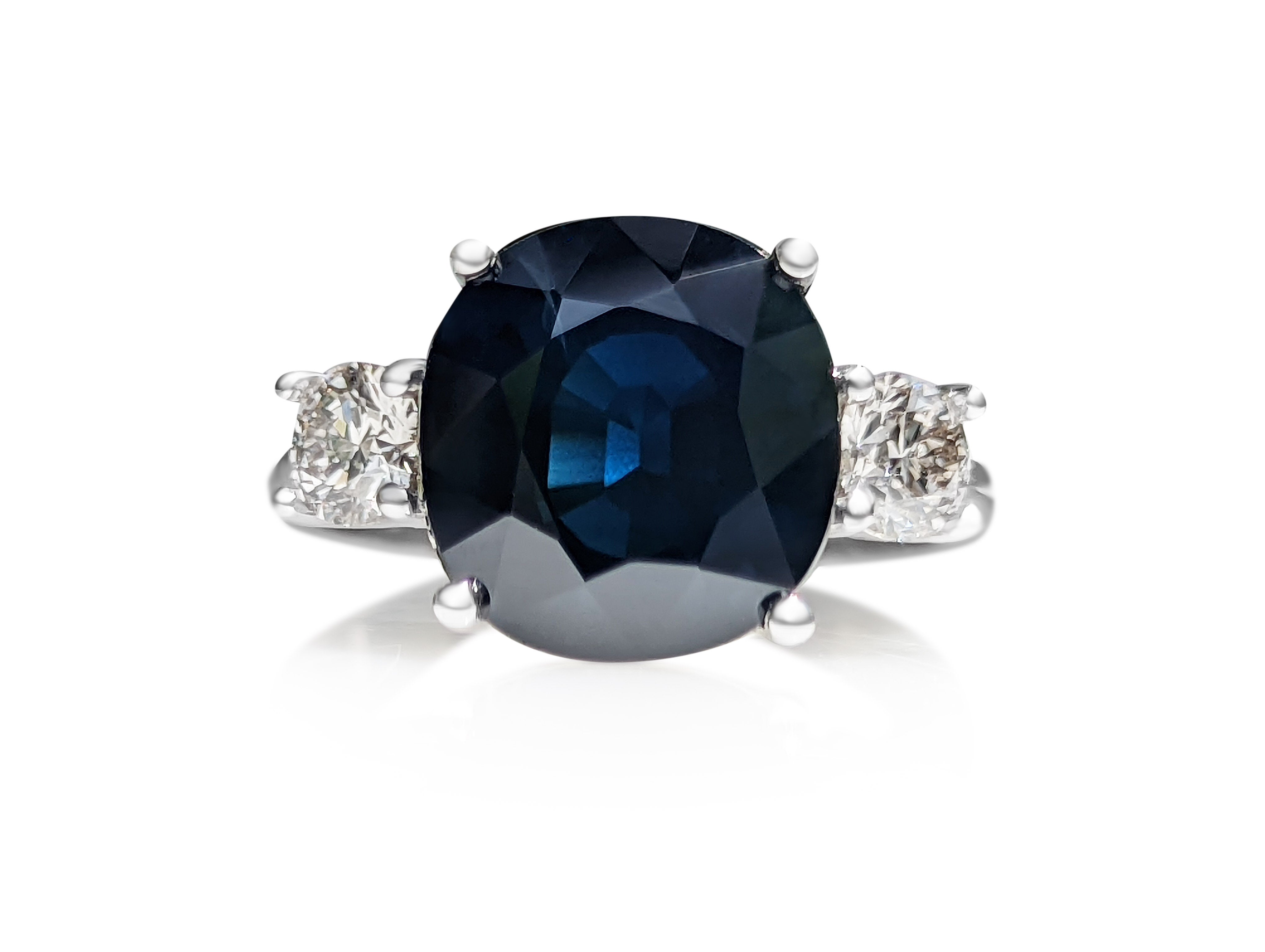 Ring can be sized free of charge prior to shipping out.    

Center Natural Sapphire
Weight: 6.50 ct
Color: Blue
Shape: Cushion Mixed

Side Stones:
Round 2 pieces / 0.62 cttw I-K VS1 Natural Diamonds

Item ships from Israeli Diamonds Exchange,