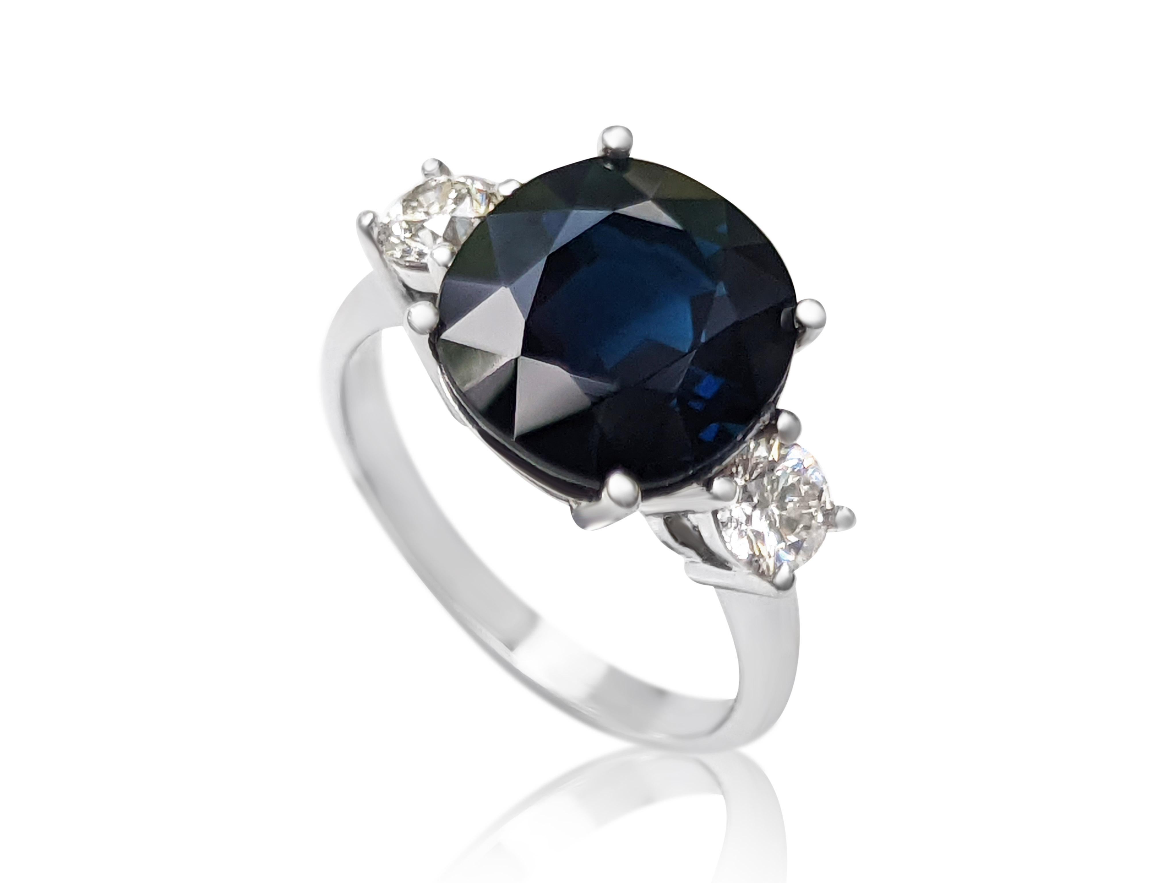 Cushion Cut 6.50 Carat Dark Blue Sapphire and 0.62 Ct Diamonds, 18 Kt. White Gold, Ring
