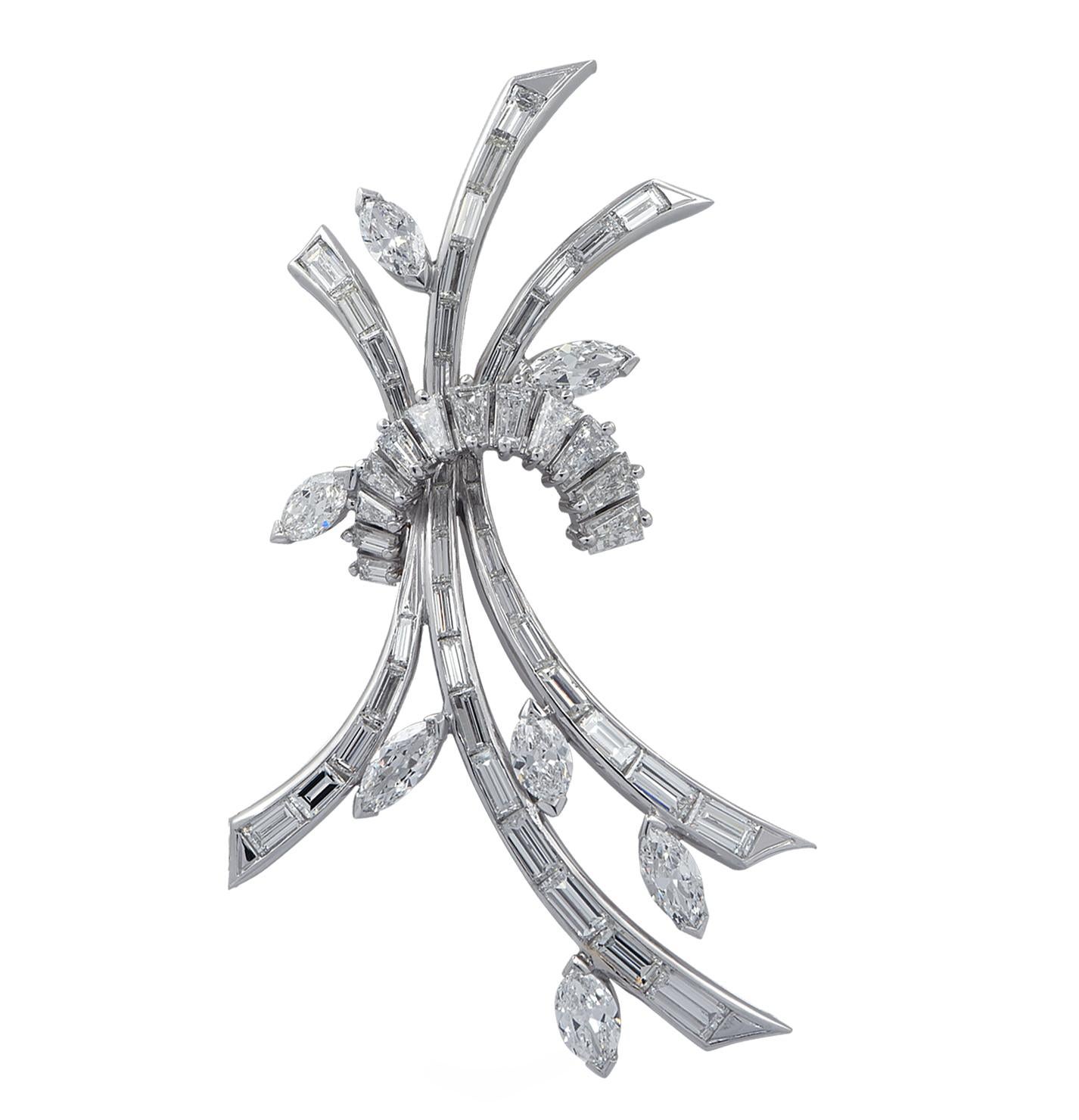 Diamond Brooch pin crafted in platinum featuring approximately 6.50 carats of mixed cut diamonds, G color, VS clarity. 48 baguette cut diamonds and 7 marquise cut diamonds are arranged into three diamond encrusted branches, tied together, capturing