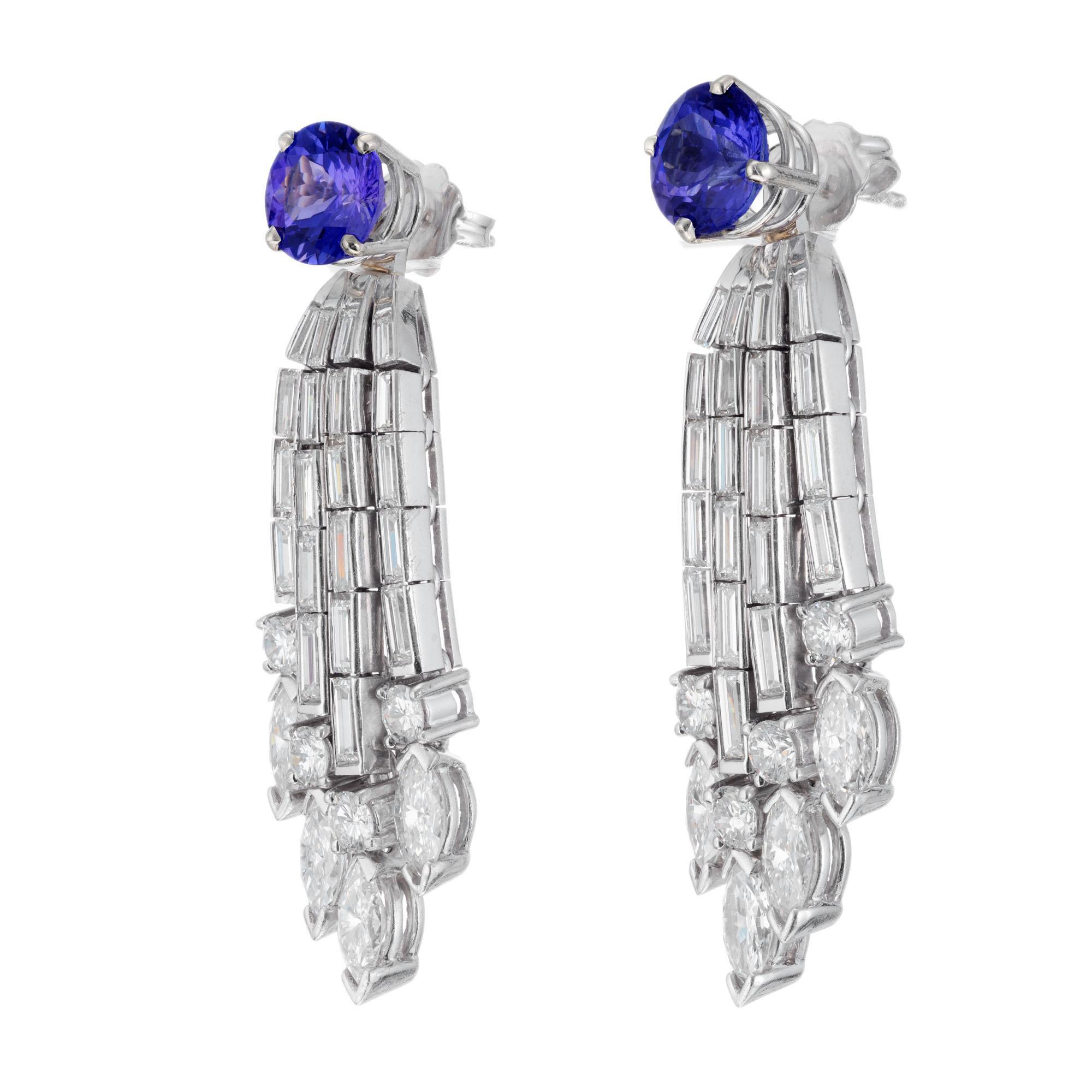 1960's Tanzanite and diamond earrings. 2 round tanzanite studs with 34 baguette, 8 marquise and 8 round accent diamonds. Flexible removable drop dangles. Platinum and 14k white gold. Earrings can be worn as tanzanite studs or with diamond drop