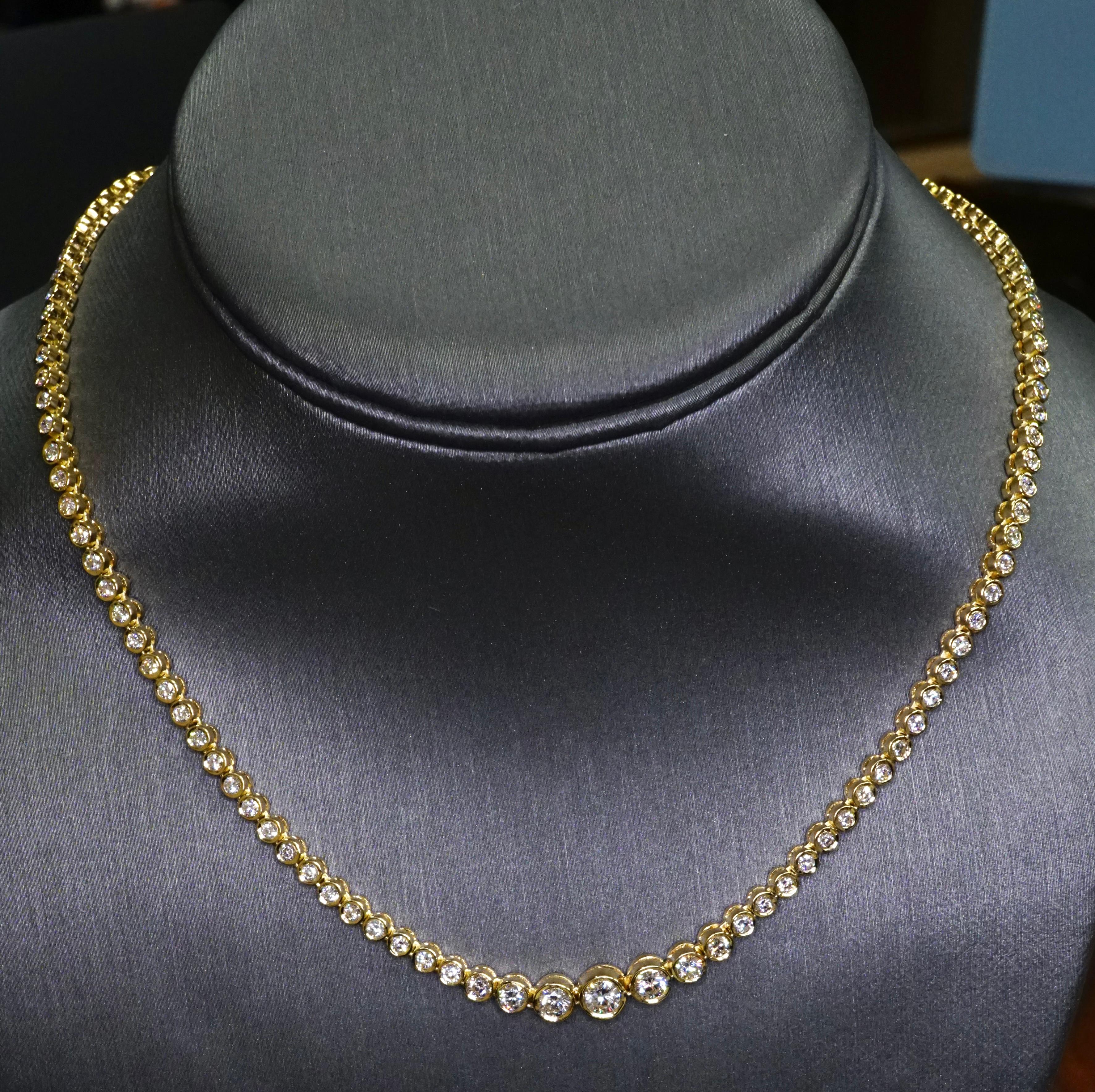 Diamond Tennis Necklace in 18K Yellow Gold. Bezel set natural brilliant round diamonds are F-G VS2-SI1. Total carat weight = 6.50ct. The length: 17