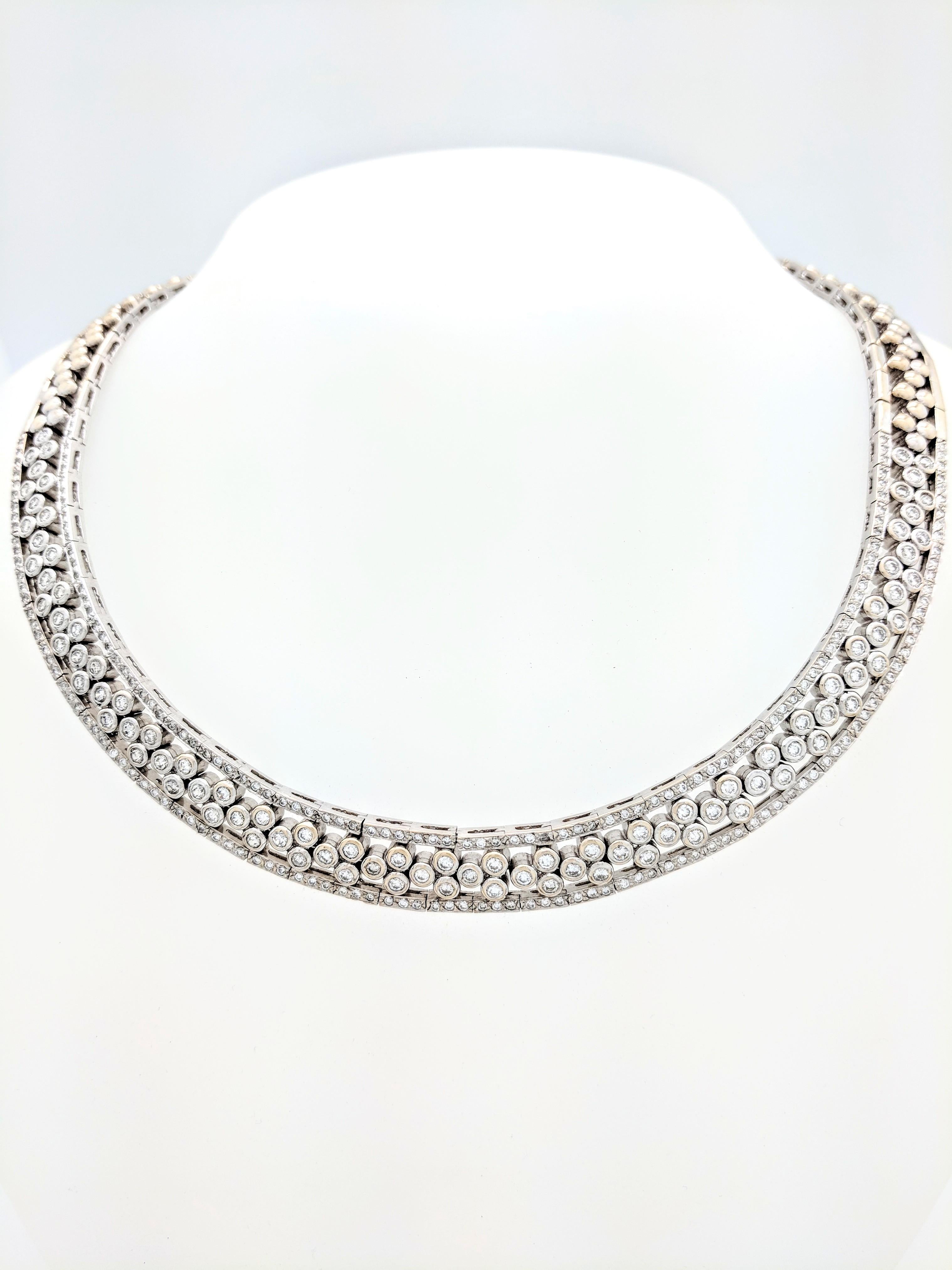 You are viewing a beautiful bezel & pave set diamond choker necklace.

This necklace is crafted from 18k white gold and weighs 104 grams. It features 93 .05ct.  natural round brilliant cut bezel set diamonds and 198 .01ct. natural round brilliant