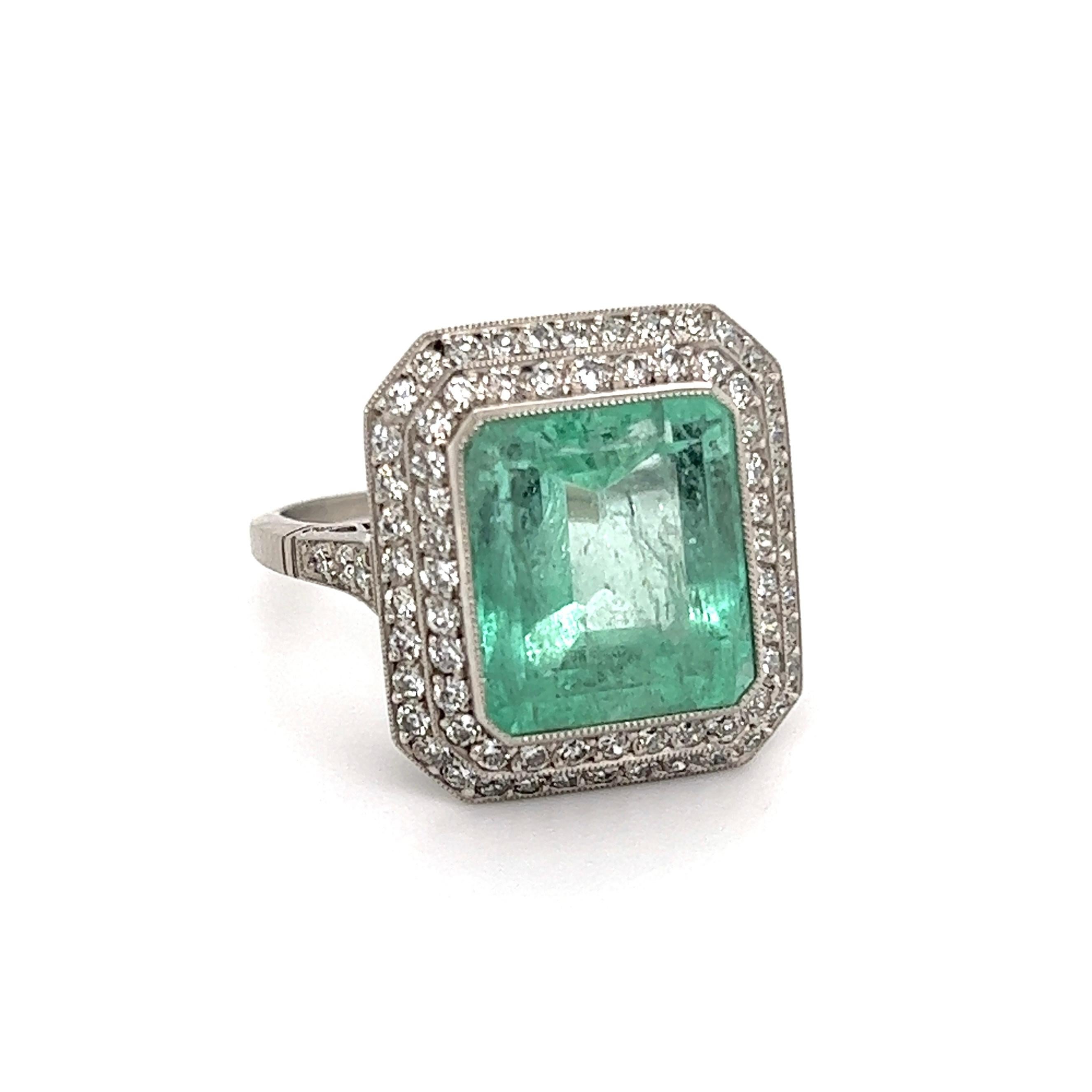 Simply Beautiful! Finely detailed Emerald and Diamond Vintage Platinum Ring. Centering a securely nestled 6.50 Carat Emerald, surrounded by 76 Old European Cut Diamonds weighing approx. 0.85tcw including 6 Diamonds, on shank. Approx. Dimensions