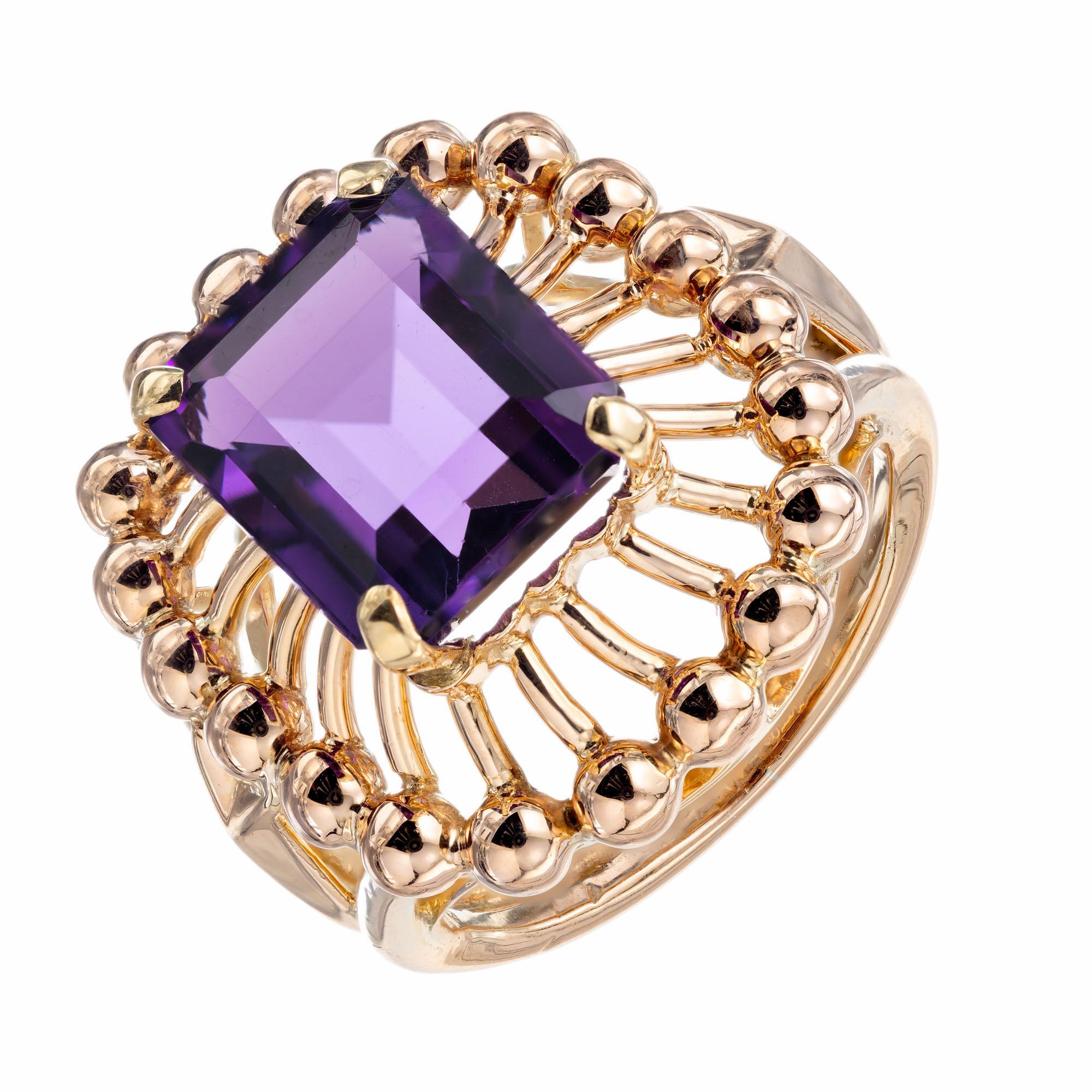 1930's 6.50 rectangle shape Amethyst center stone with a gold bead halo in a 18k rose gold setting. 

1 12 x 10mm bright gem natural purple Amethyst, approx. total weight 6.50cts
Size 8.5 and sizable
18k pink gold
Tested: 18k pink gold
10.4