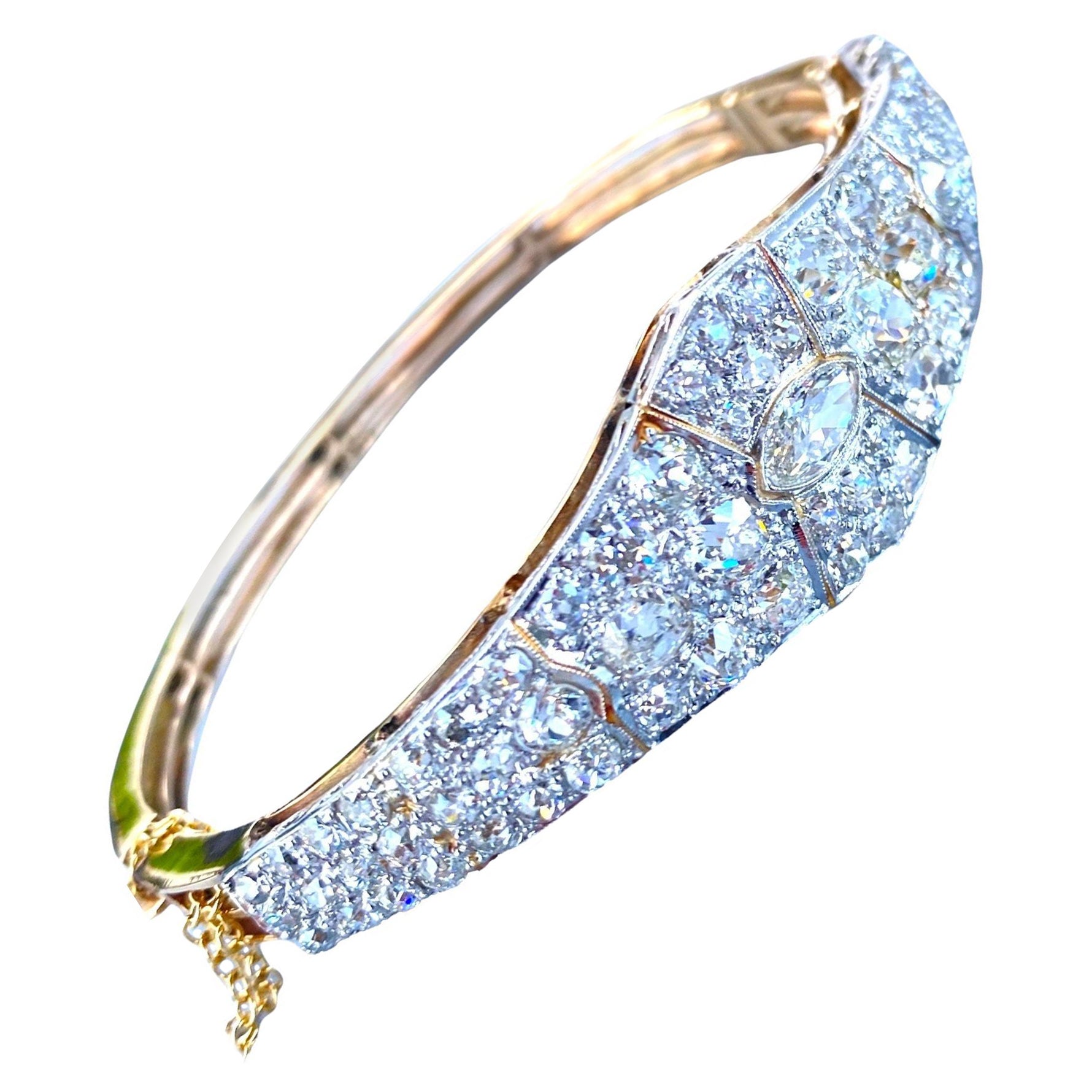 Platinum encrusted diamond pave bracelet. The bracelet base and backside are all made of yellow-colored gold.
Exceptional diamonds are pave-set in platinum.
 European cut diamonds set in platinum. 
The quality of diamonds is VS
 clarity and F-G