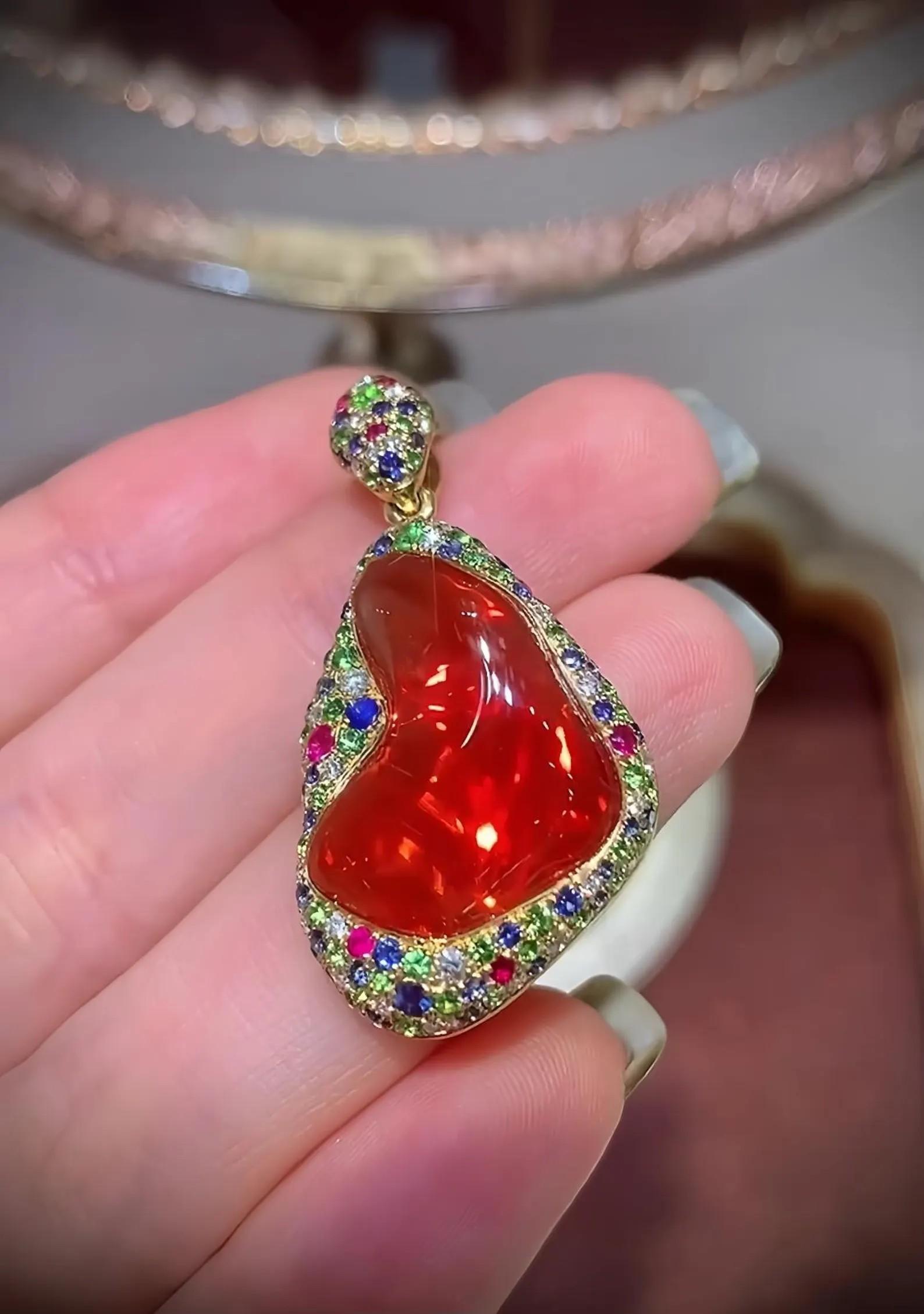 Cast in 18 Karat gold, this beautiful pendant features 6.50 carats of fire opal & 2.0 carats of sparkling diamonds.  

FOLLOW  MEGHNA JEWELS storefront to view the latest collection & exclusive pieces.  Meghna Jewels is proudly rated as a Top Seller