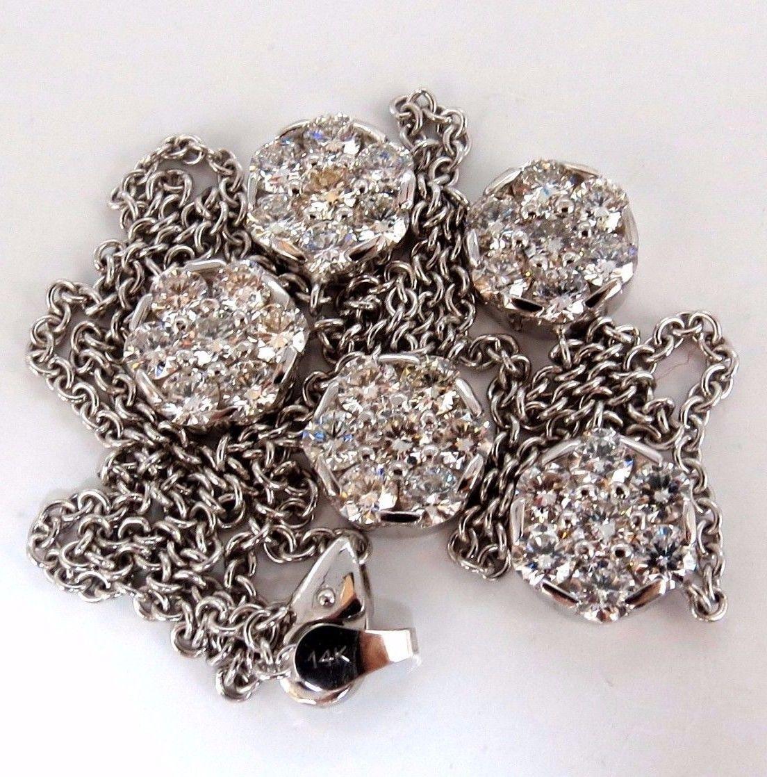 6.50ct. (5) Collier Clusters by Yard.

 Diamants ronds brillants pleine taille.

 Vs-2  La clarté. 

G-color.

or blanc 14kt. / 18 pouces

14.5 grammes.

Chaque grappe : 0,40 pouce

32 000 $ Certificat d'évaluation à accompagner