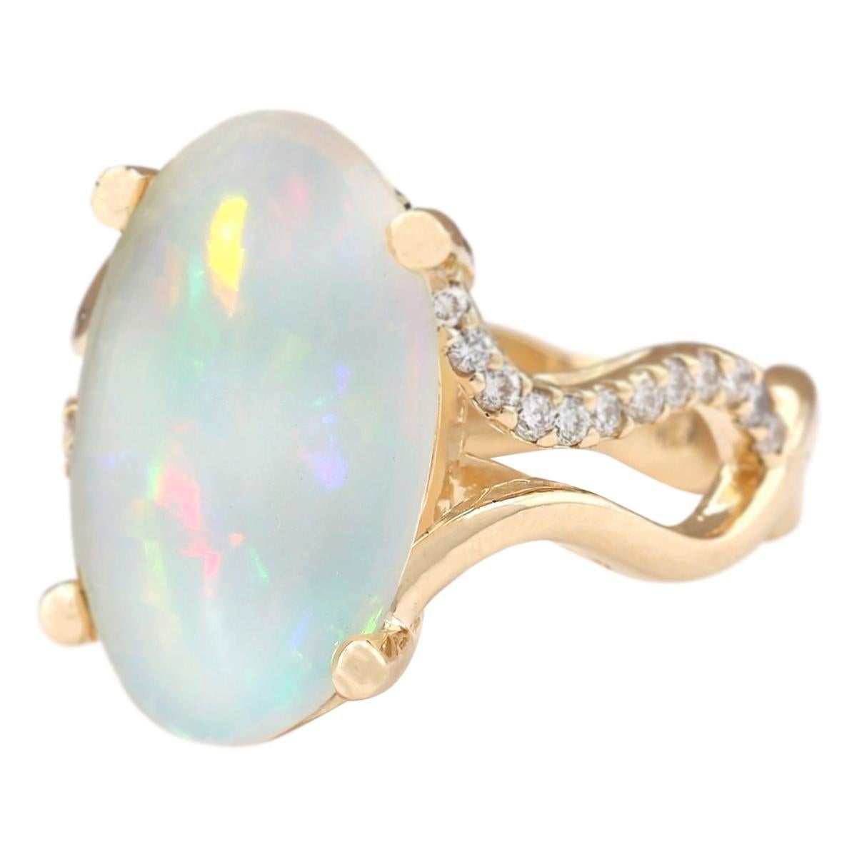 6.50 Carat Natural Opal 14 Karat Yellow Gold Diamond Ring
Stamped: 14K Yellow Gold
Total Ring Weight: 8.1 Grams
Total Natural Opal Weight is 6.00 Carat (Measures: 18.00x12.00 mm)
Color: Multicolor
Total Natural Diamond Weight is 0.50 Carat
Color: