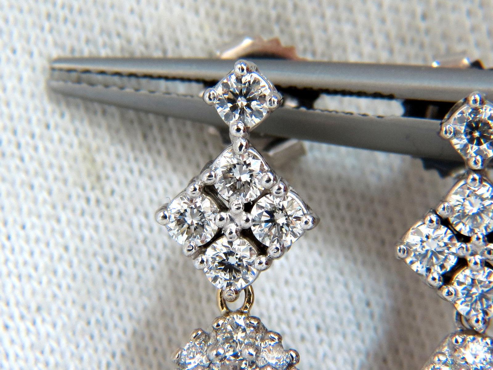 Pear Cluster Dangle earrings.

The Victorian Revival.

6.50cts of natural round diamonds: 

G-color, Vs-2 clarity.

14kt. white gold

11.1 grams.

Earrings measure: 33mm long (1.3 Inch)

12.7mm (.50 inch) diameter on lower larger