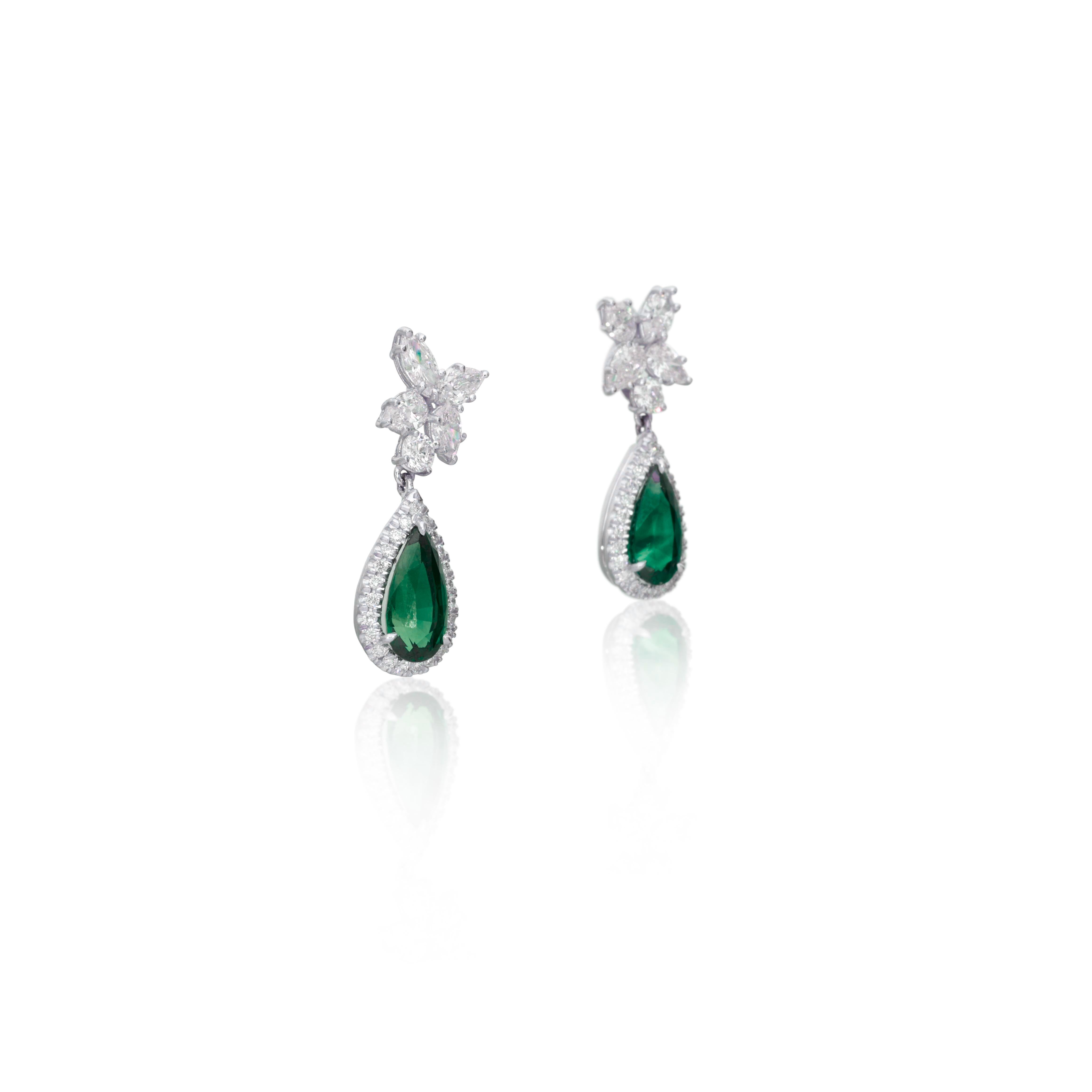 Composed of pear-shaped sapphires, accented by pear-cut and round brilliant-cut diamonds.

Emeralds weighing a total of approximately 4 carats
Diamonds weighing a total of approximately 2.50 carats
18 karat white gold
Fitted with posts