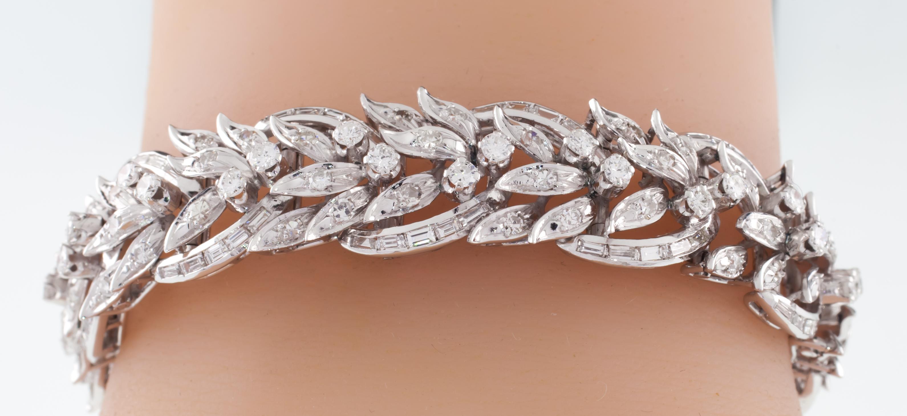 Gorgeous Platinum Diamond Bracelet
Features Round and Baguette Diamonds in Intricate Floral/Leaf Design
Outer Petals Set w/ Channel Set Baguettes
Inner Petals Set w/ Pave Round Diamonds
Prong-Set Round Diamond Accents
Total Diamond Weight = 6.50
