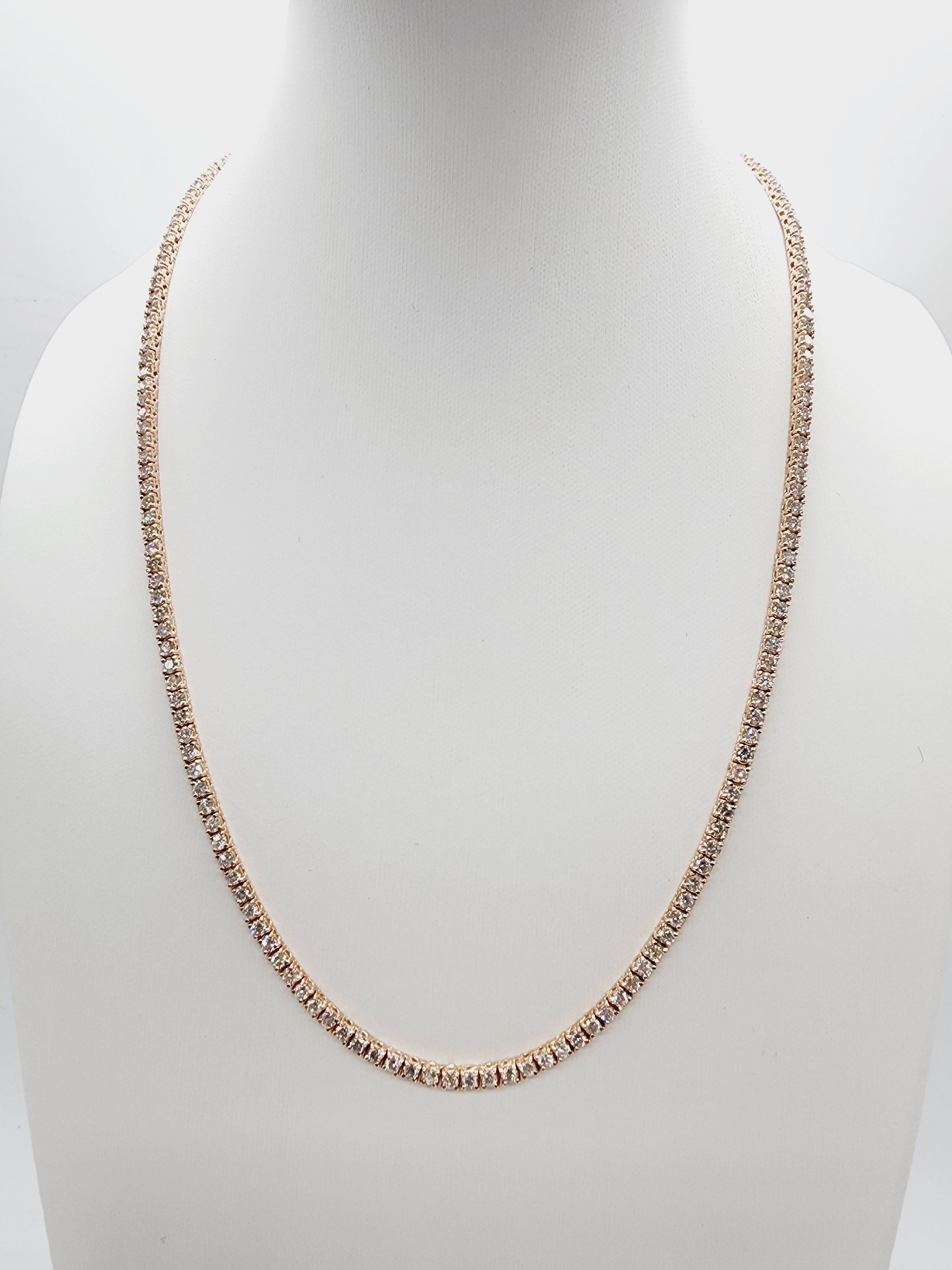 Brilliant and beautiful tennis necklace, natural round-brilliant cut white diamonds clean and Excellent shine. 14k rose gold classic four-prong style for maximum light brilliance. Elegance for every occasion.

16 inch length. 
Average H Color, SI