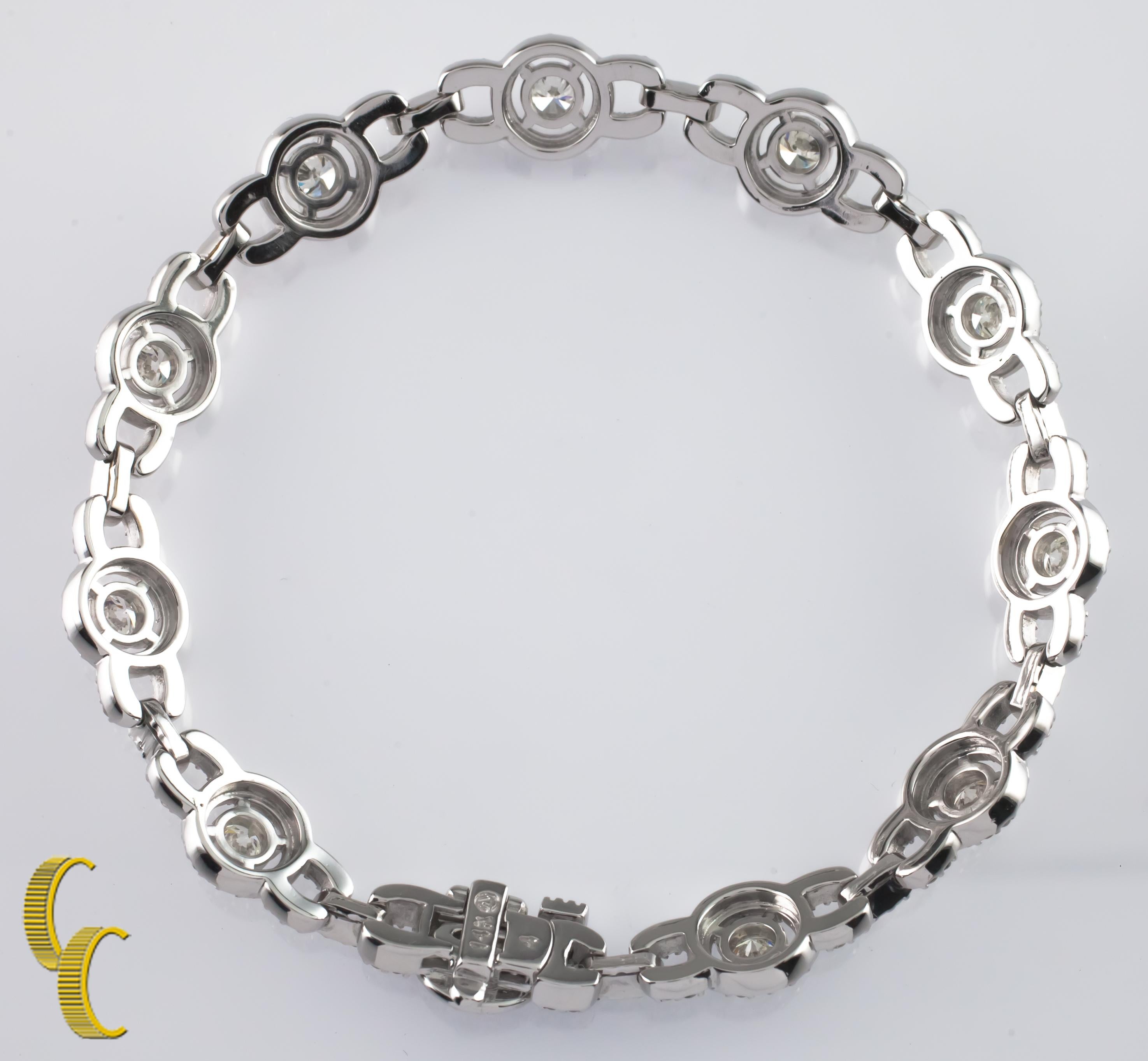 Gorgeous, Unique Diamond Tennis Bracelet!
14k White Gold Setting
Features Solitaire Round Diamonds in Halo Settings w/ Diamond-Studded Links
Total Diamond Weight = Approximately 6.5 ct
Average Color = I - J
Average Clarity = SI
Total Length = 7