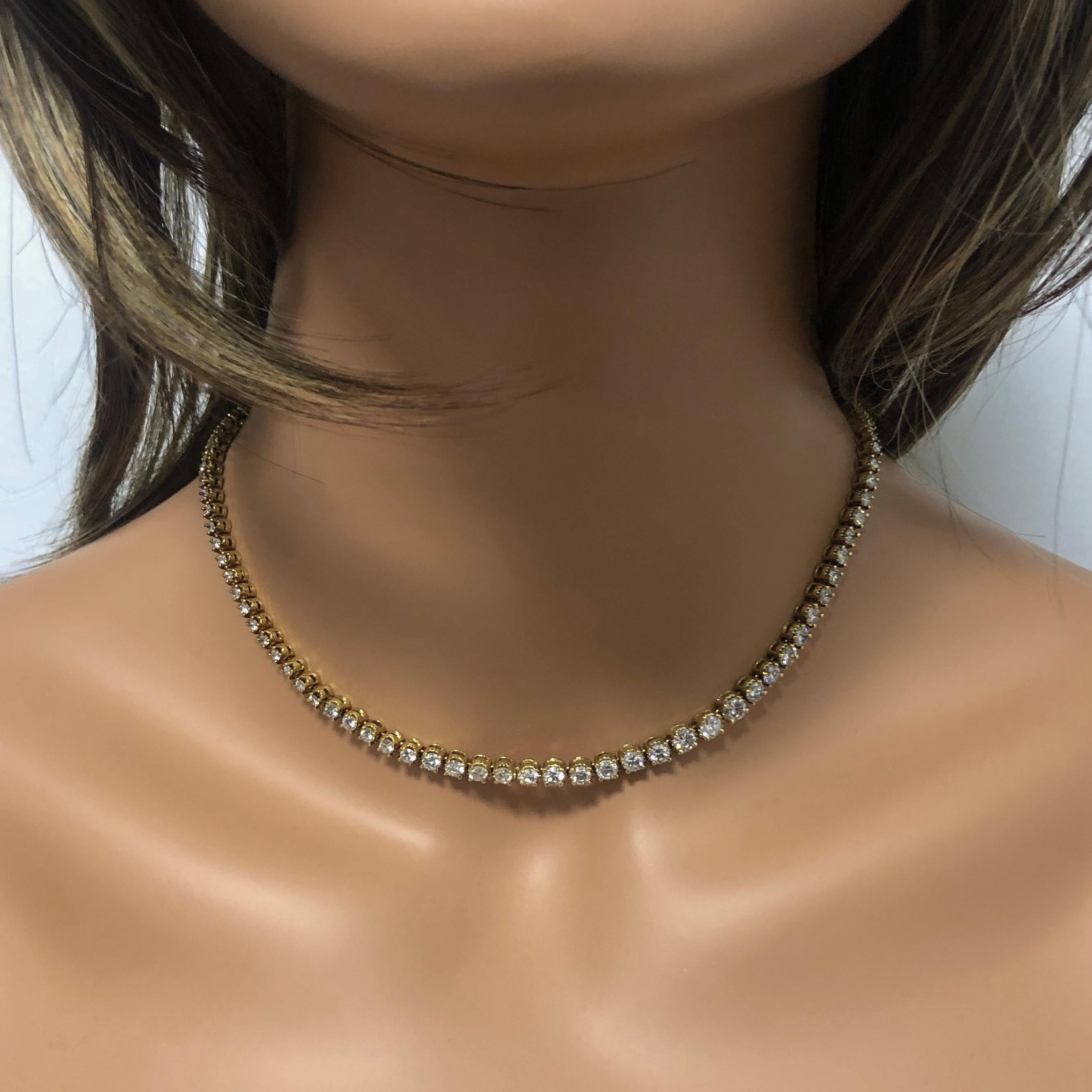 Sparkle in the spotlight with this magnificent and classy diamond necklace. Features 103 sparkling diamonds weighing 6.50 carats total. Each diamond graduates in size and is set in its own 18k yellow gold basket. A definite must have for anyone.