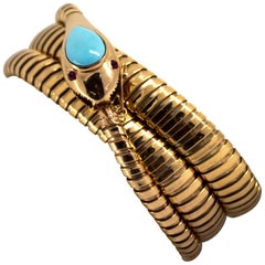 6.50 Carat Turquoise 0.12 Carat Ruby Yellow Gold "Snake" Bracelet