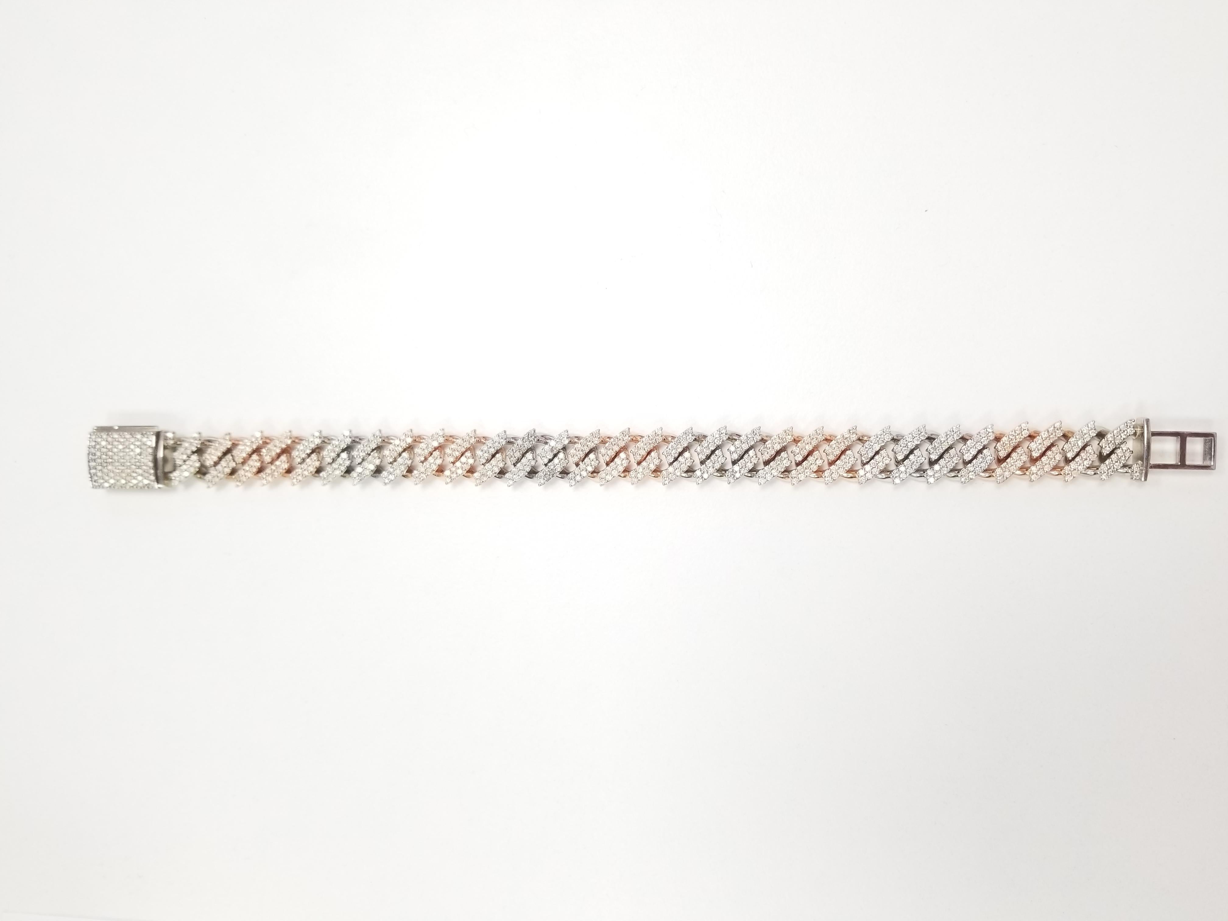 Two-Tone Cuban 6.50 cttw Natural Diamond Bracelet Solid Gold 14K 8.5''
White/Rose gold, very shiny, 64.50 grams gold, with box tongue clasp.
Average color I , clarity I.  10 mm width. 