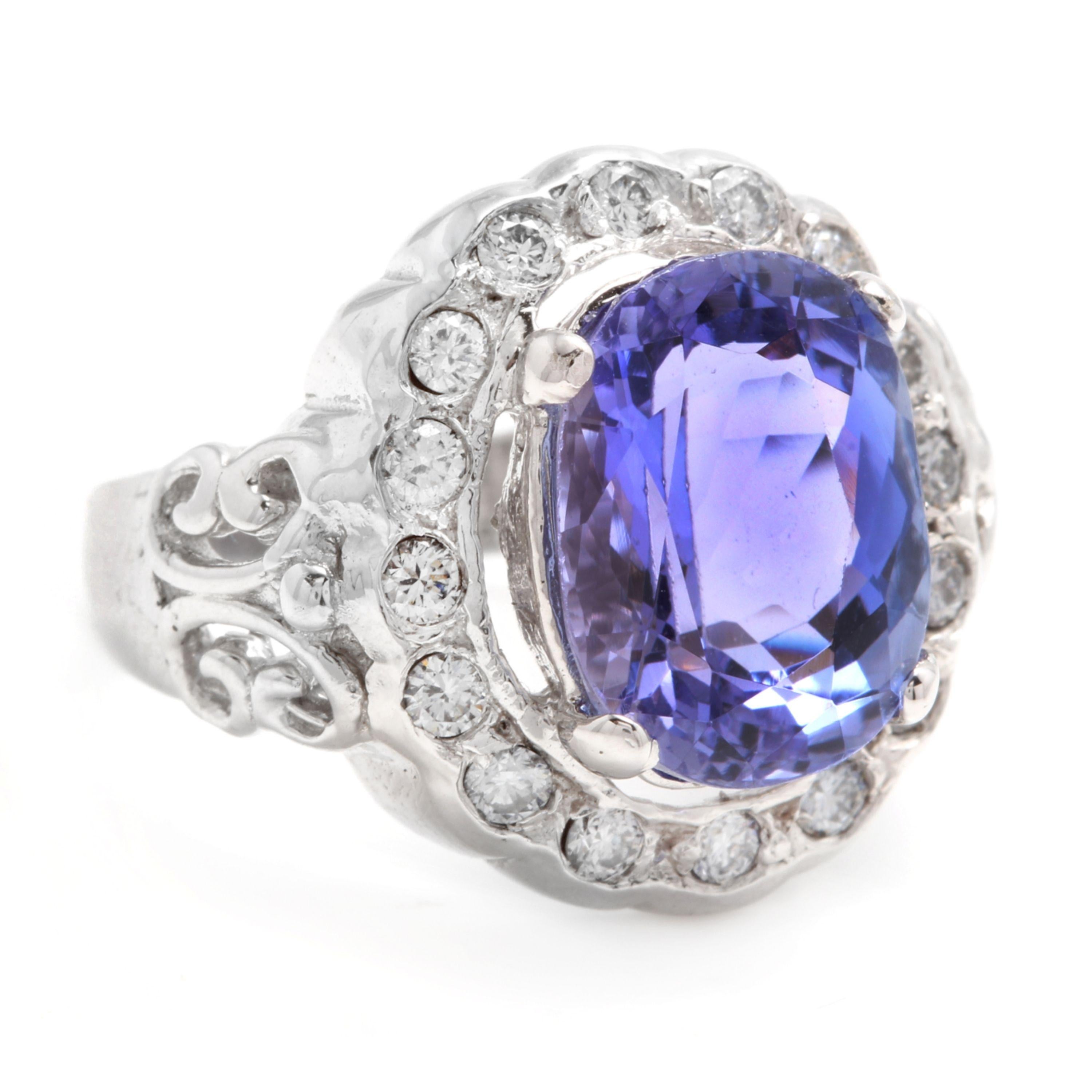 6.50 Carats Natural Very Nice Looking Tanzanite and Diamond 14K Solid White Gold Ring

Total Natural Oval Cut Tanzanite Weight is: Approx. 6.00 Carats

Tanzanite Measures: Approx. 12.00 x 10.00mm

Natural Round Diamonds Weight: Approx. 0.50 Carats