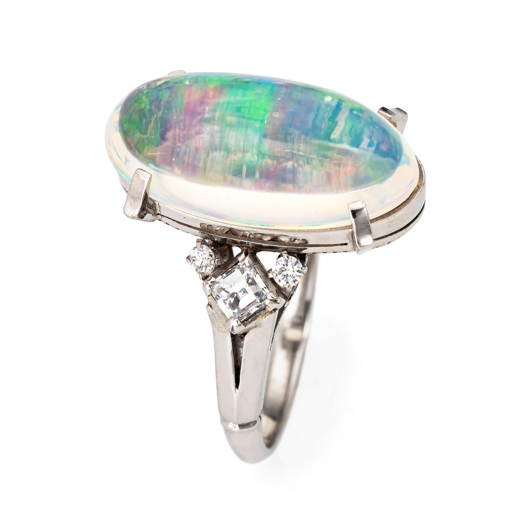 Stylish natural jelly opal & diamond ring crafted in 850 platinum. 

Natural jelly opal measures 18mm x 9mm (estimated at 6.50 carats) accented with an estimated 0.28 carats of diamonds (estimated at G-H color and VS2-SI1 clarity). The opal is in