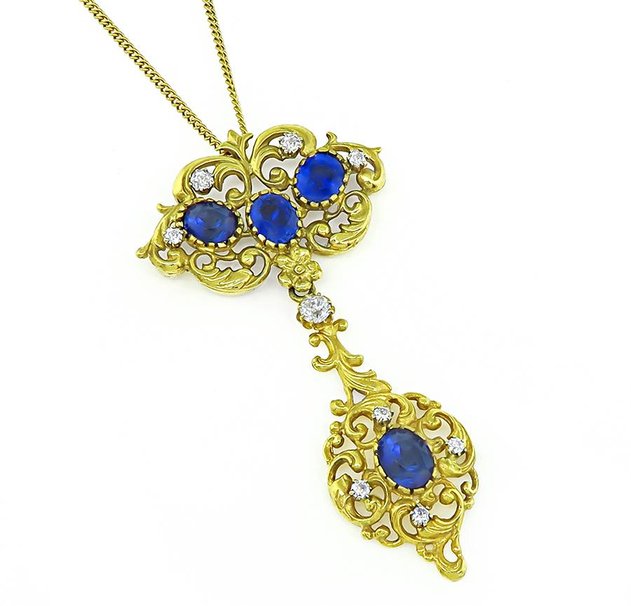 This is a charming 18k yellow gold pendant necklace. The pendant is set with lovely oval cut sapphires that weigh approximately 6.50ct. The sapphires are accentuated by sparkling old mine and jubilee cut diamonds that weigh approximately 0.50ct. The