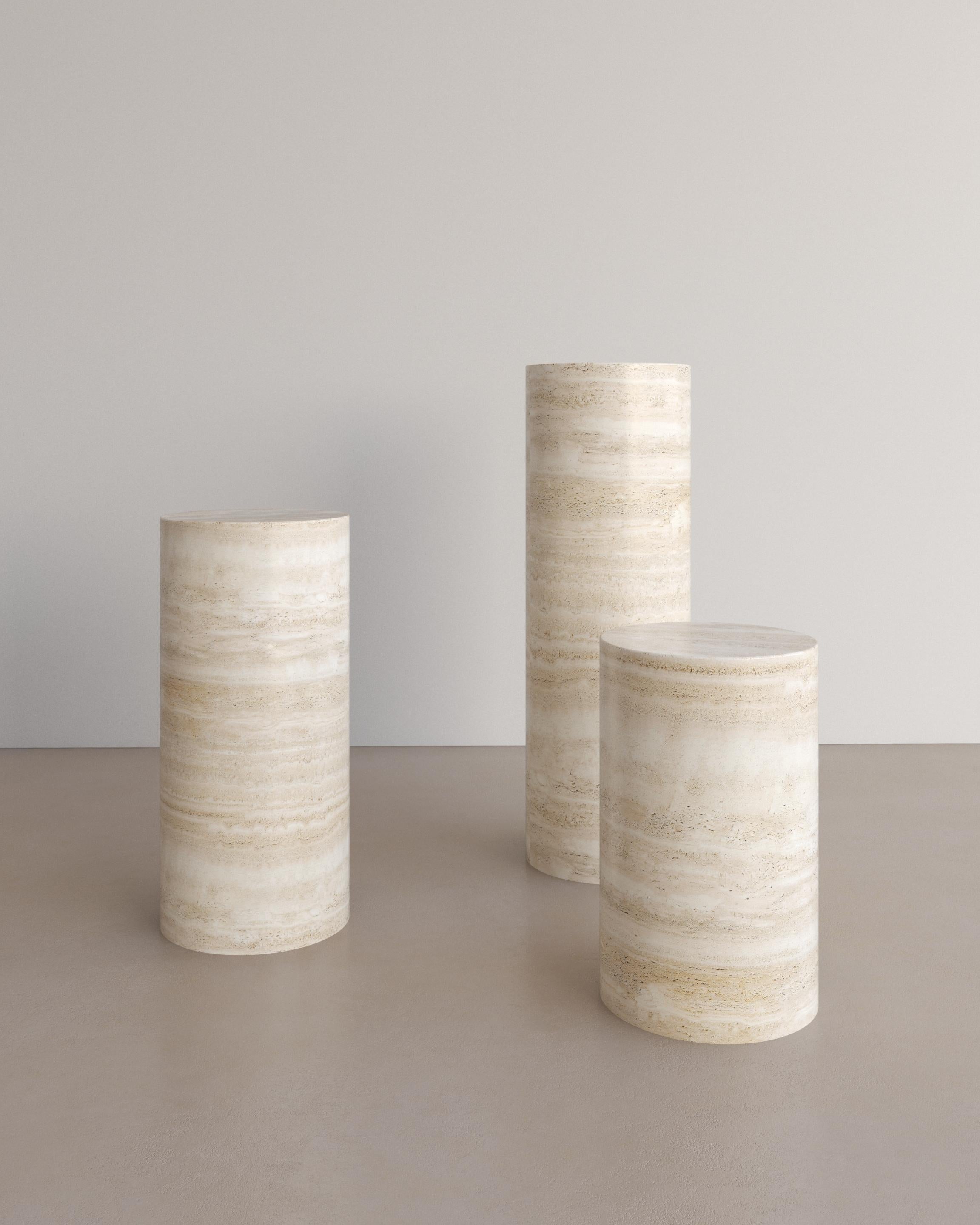 The Voyage Pedestal in Nude Travertine by The Essentialist is envisioned as an ode to historical elegance, captured through a modern lens of minimalistic opulence. Play with scale and verticality by positioning two or three varying heights within