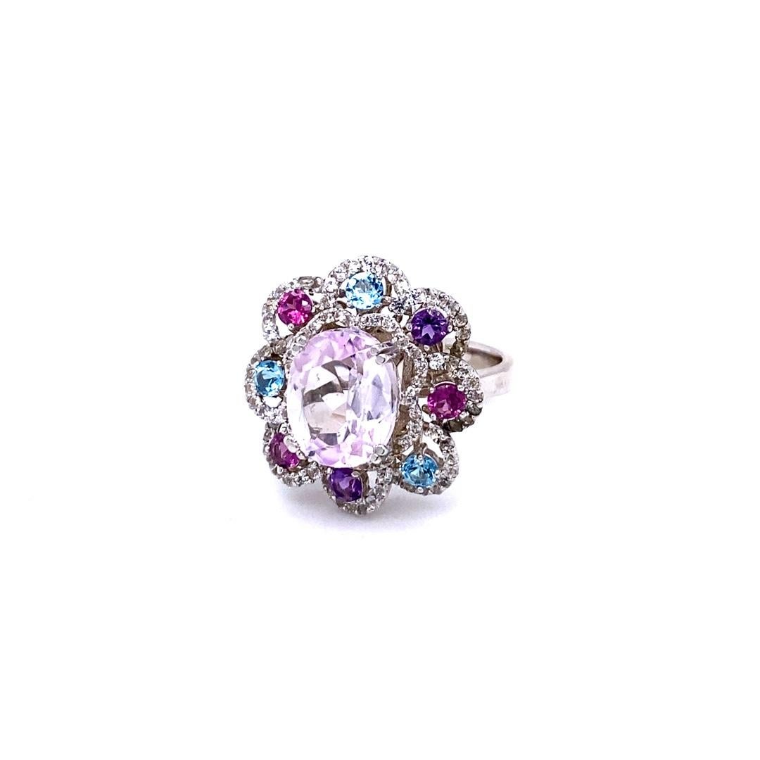 6.51 Carat Kunzite Amethyst Sapphire White Gold Cocktail Ring

This beautiful ring has a Oval Cut 4.43 carat Kunzite that measures at approximately 10 mm x 12 mm. There are Blue Topaz, Garnet, Amethysts surrounding the ring that weigh 0.98 carats.