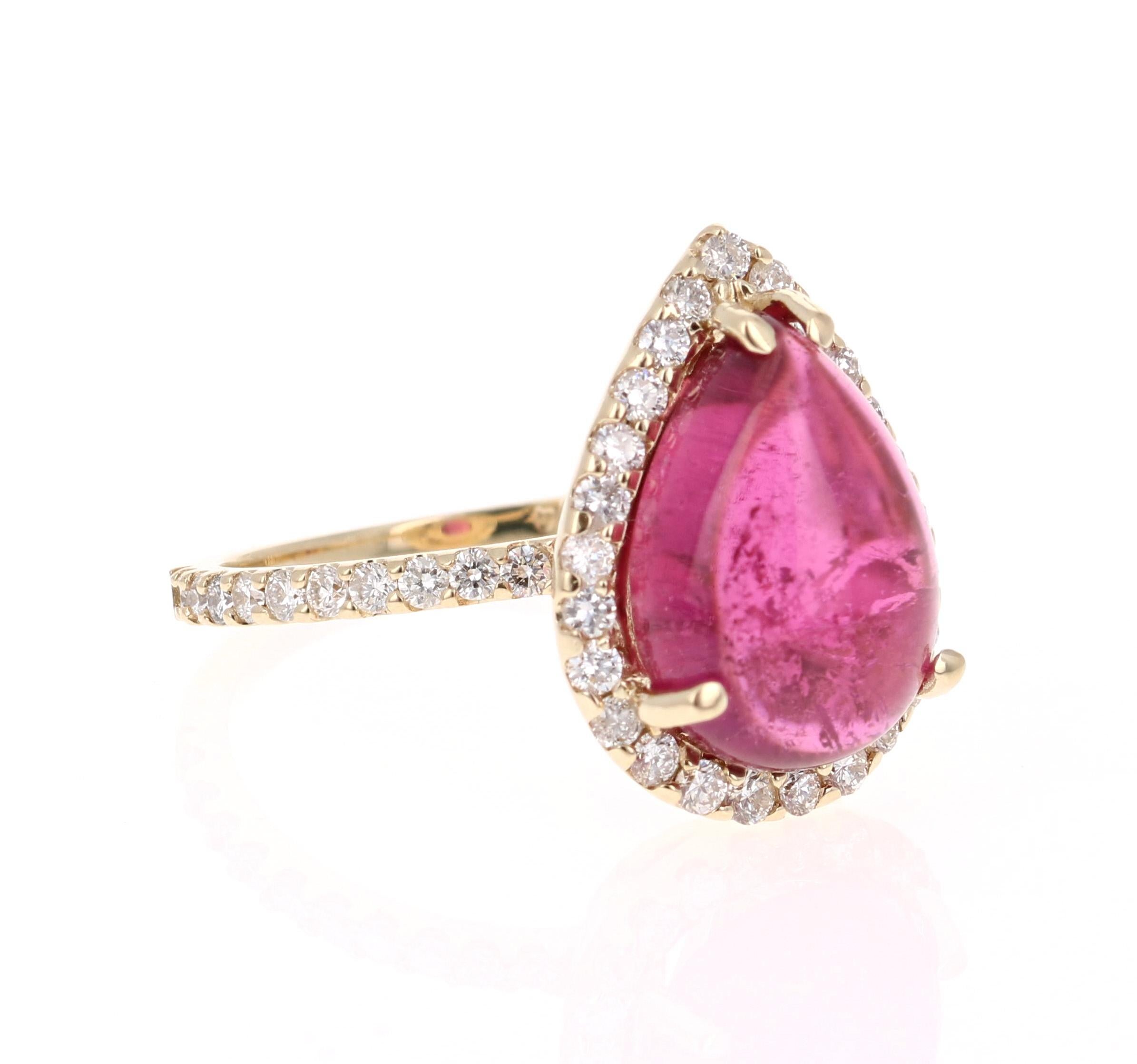 This ring has a simply gorgeous Pear Cut/Cabochon Pink Tourmaline that weighs 5.72 Carats. Floating around the tourmaline is a simple halo of 46 Round Cut Diamonds that weigh 0.79 Carats. The total carat weight of the ring is 6.51 Carats. 

This