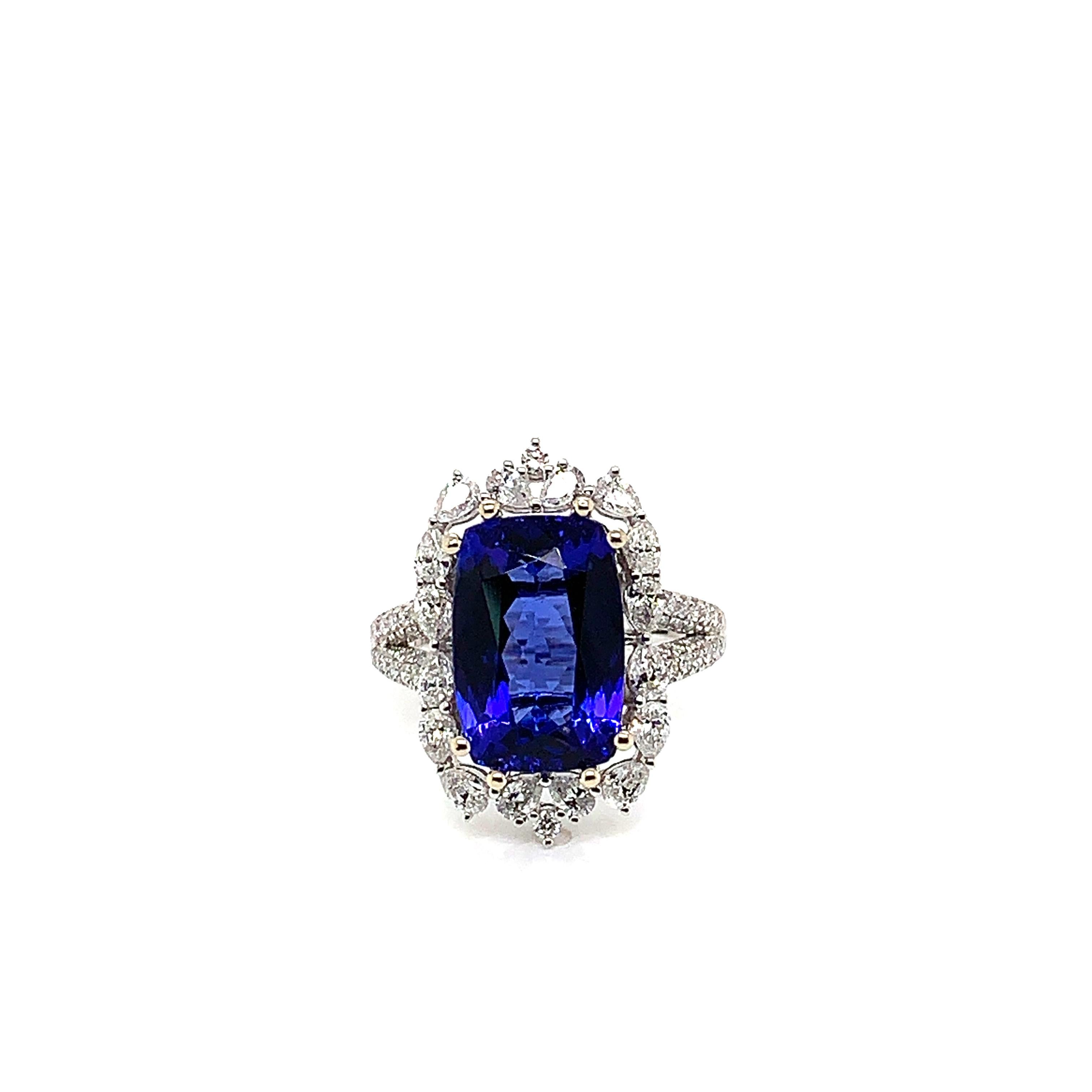 Classic tanzanite ring in 18K white gold with diamonds. 

Tanzanite: 6.52 carat cushion shape.
Diamonds: 1.207 carat, G colour, VS clarity. 
Gold: 5.859g, 18K white gold. 