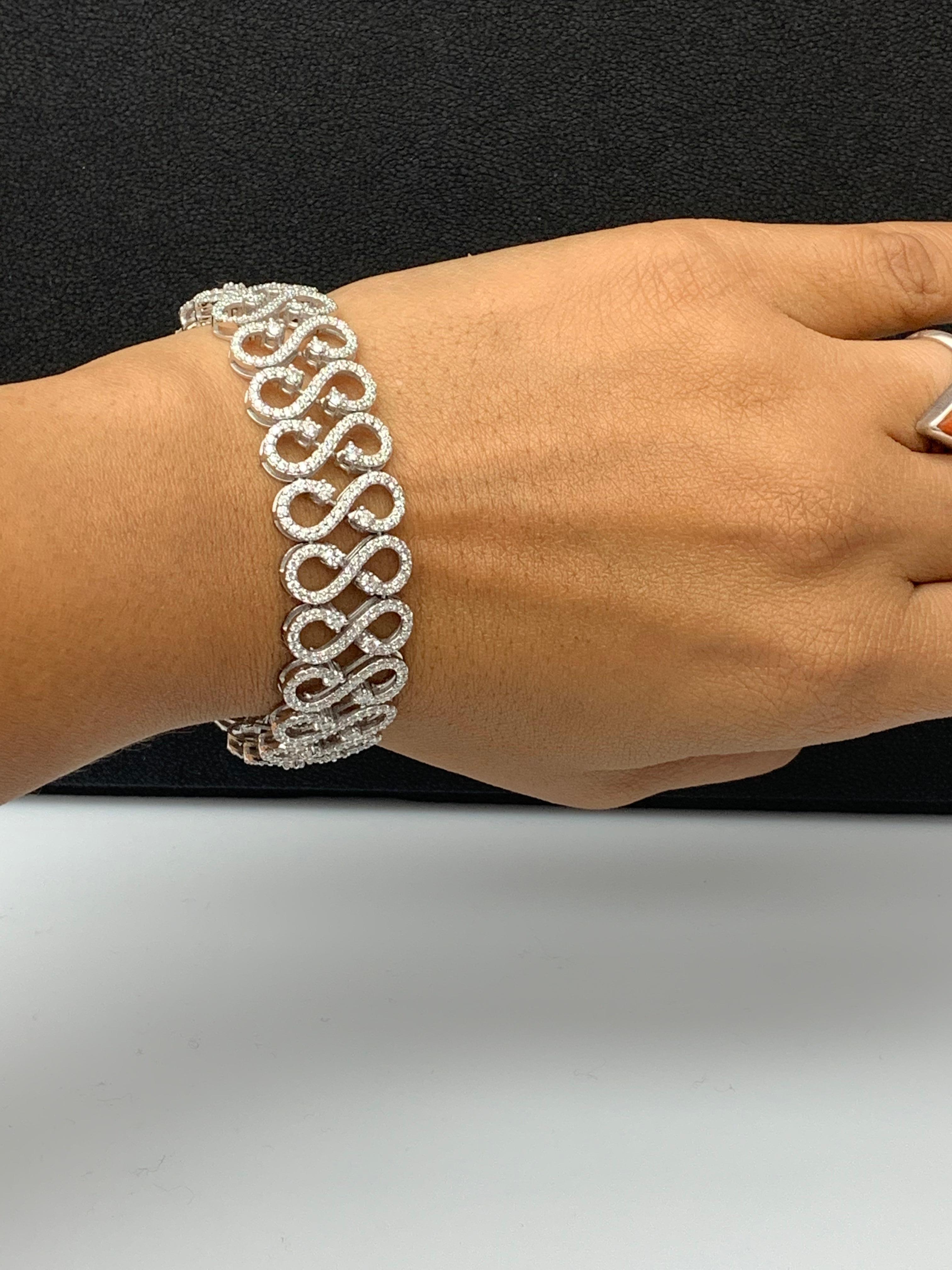 A beautiful bracelet showcasing open-work design, set with round brilliant diamonds set in  