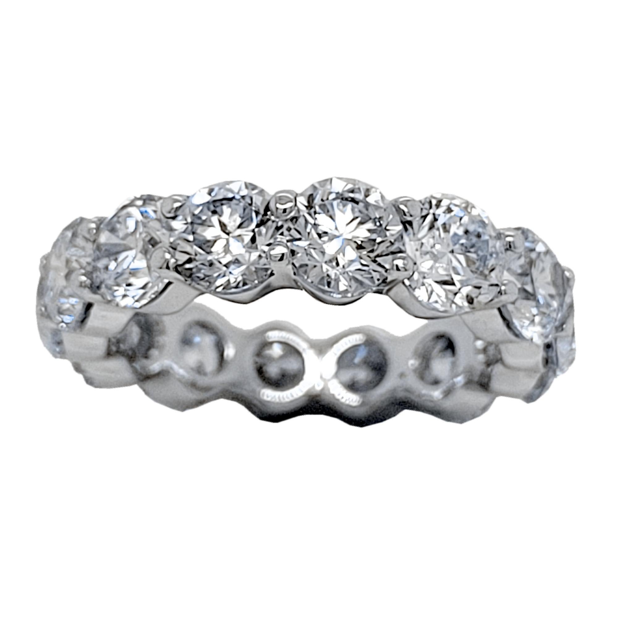 This beautiful Eternity Ring is made in 18K Gold with 14 perfectly matched 5mm Round Brilliant Diamonds Set in Shared Prong Mode In a 18K Gold mounting.
Total Weight of diamonds: 6.53 Ct  SI/F-G
Total Weight of the Ring: 6.1 Gr 18K Gold
Ring Size:
