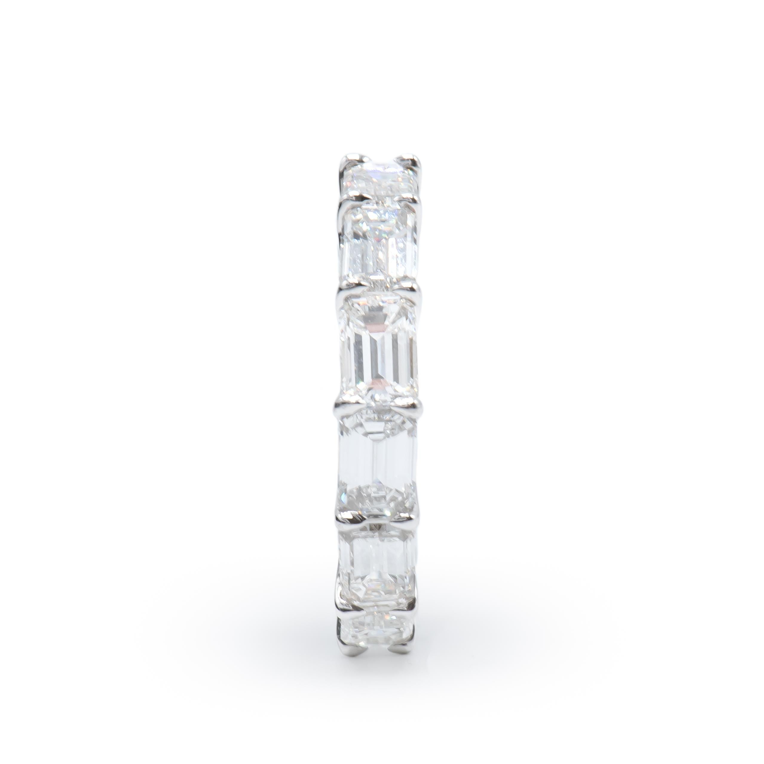 Classic Emerald Cut Diamond Eternity Band Horizontally Set featuring 13 Stones weighing a Total of 6.54 Carats. 
Diamonds are of F color and VS Clarity.
Set in Platinum.
Size 7