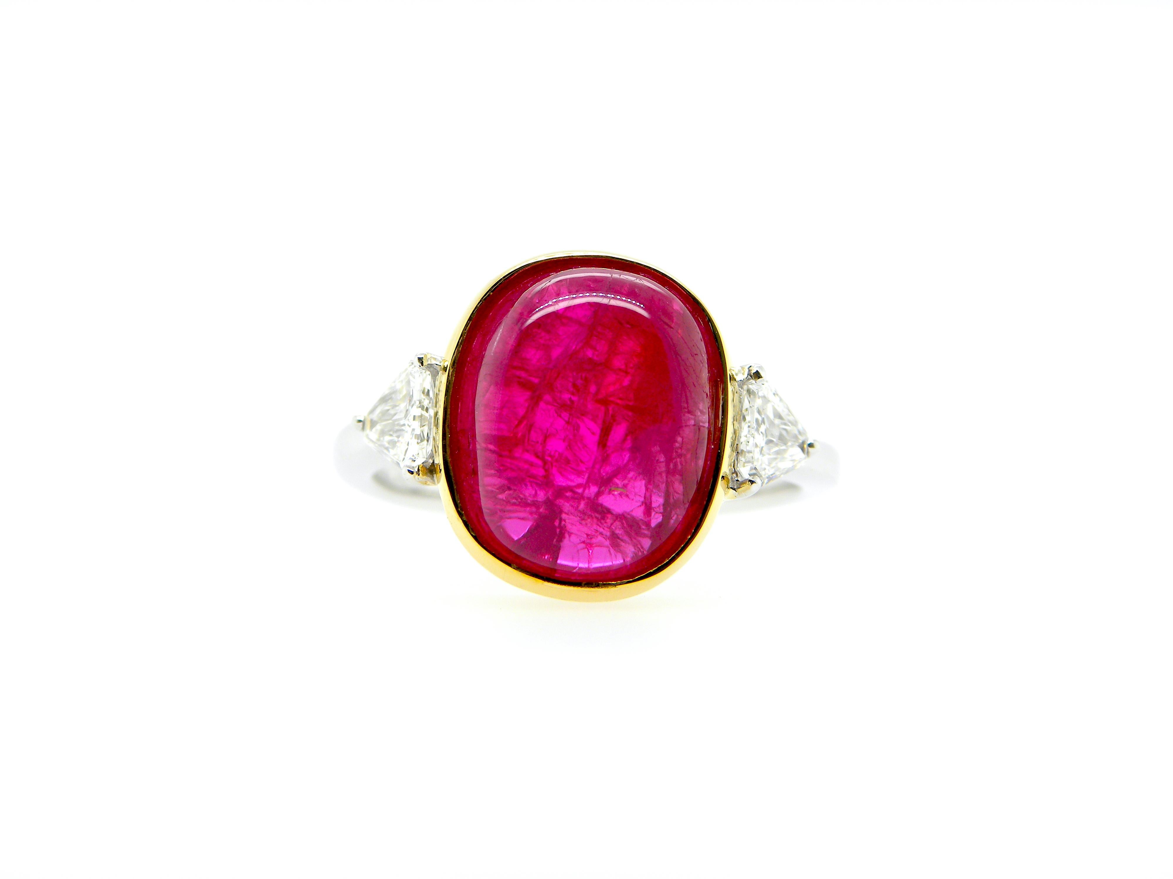 6.54 Carat GIA Certified Burma No Heat Ruby Cabochon and White Diamond Ring:

A superb and rare ring, it features a gorgeous GIA certified 6.54 carat unheated Burmese ruby cabochon flanked by white shield-cut diamonds weighing 0.42 carat. The ruby,