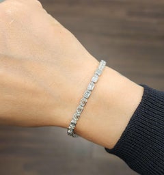 Bracciale Tennis 6.54 carati taglio smeraldo con castone Est-Ovest