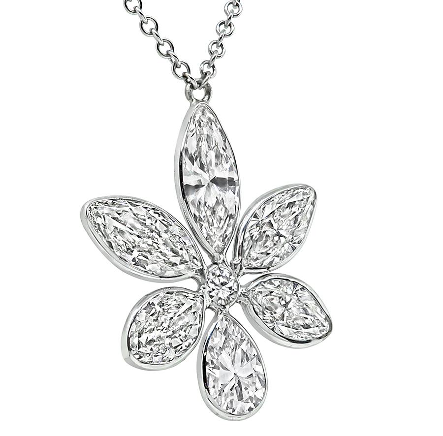 This is a gorgeous 14k white gold pendant necklace. The pendant is set with sparkling pear, round and marquise cut diamonds that weigh approximately 6.54ct. The color of these diamonds is I-J with VS2 clarity. The pendant measures 27mm by 21mm while