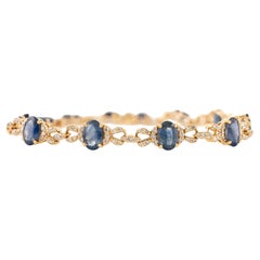 6.54Ct Oval Cut Blue Sapphire
Diamond Tennis Bracelet in Solid 14K Yellow Gold