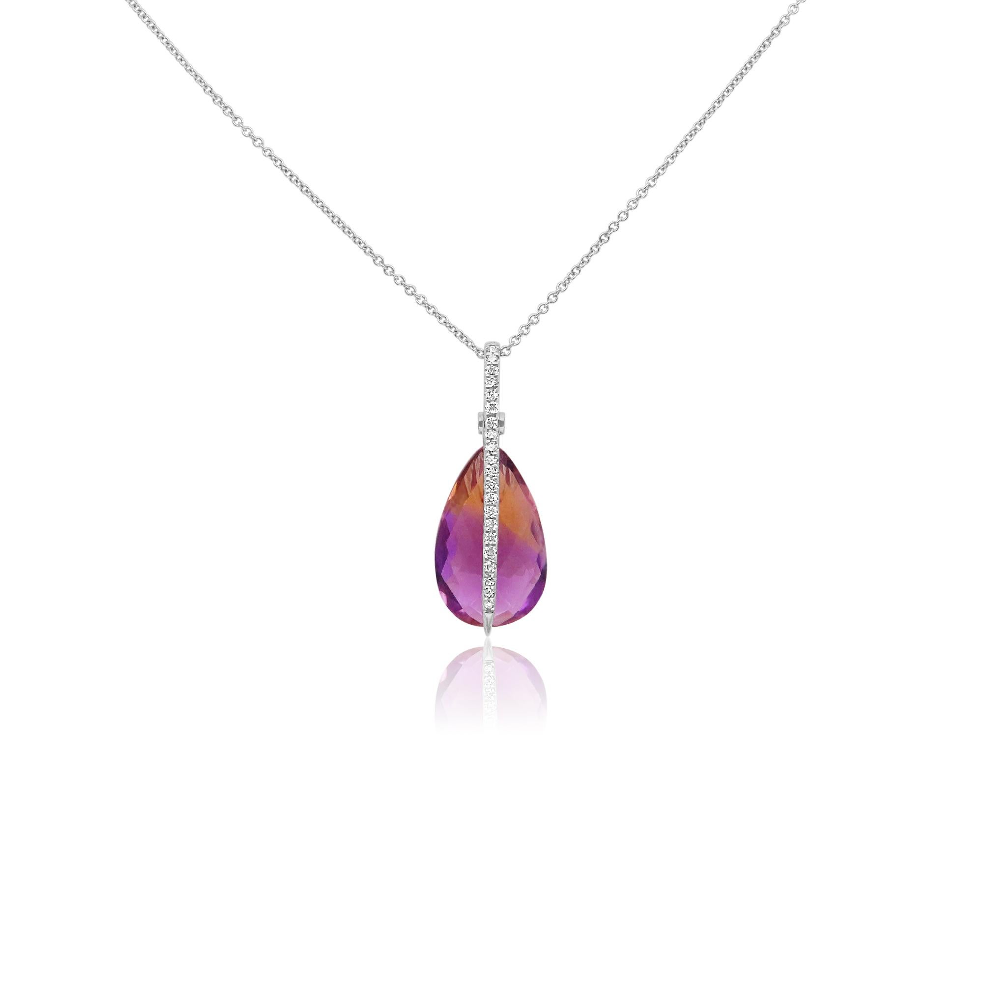 Material: 14K White Gold
Stone Details: 1 Pear Shaped Bi-Color Ametrine at 6.55 Carats - Measuring 16.9 x 10.5 mm
Diamond Details: Brilliant Round White Diamonds at 0.23 Carats- Clarity: SI / Color H-I

Fine one-of-a-kind craftsmanship meets